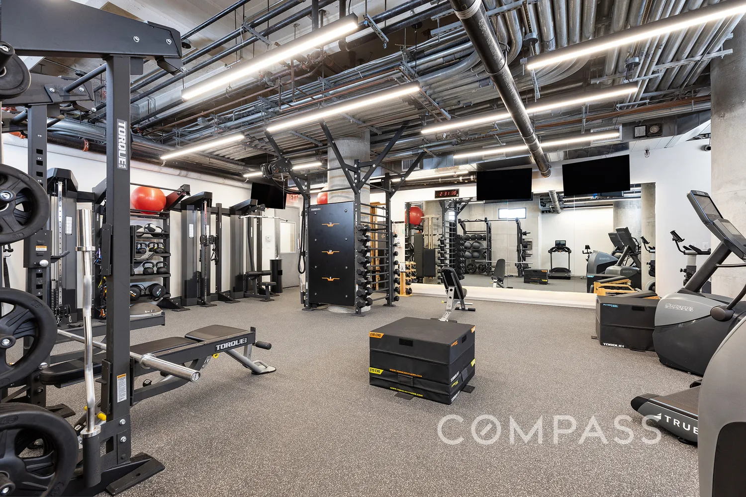a front view of a house with a yard and fountain