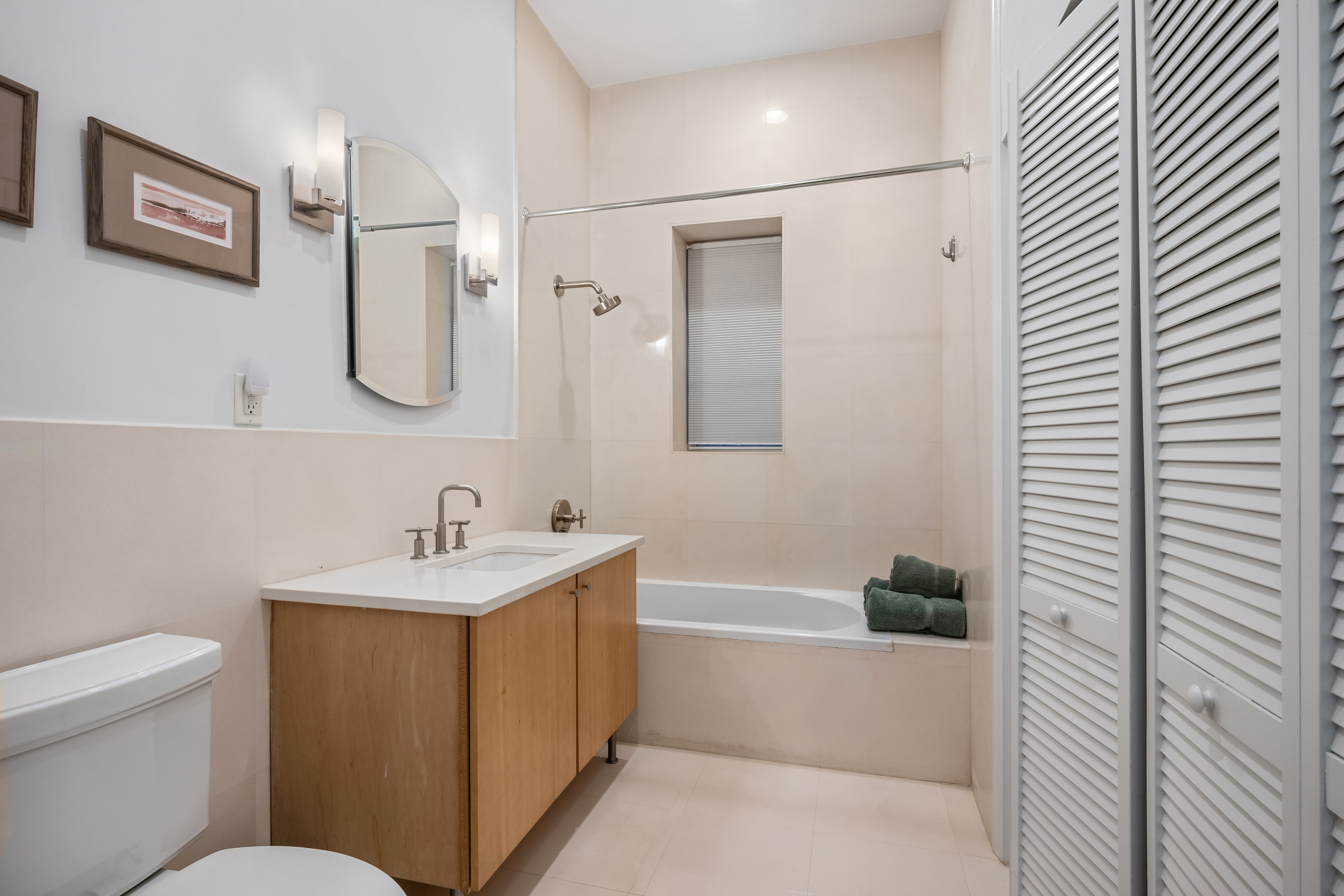 302 West 122nd Street, Unit 1 Manhattan, NY 10027 - Photo 6 of 13 a bathroom with a sink a toilet and shower
