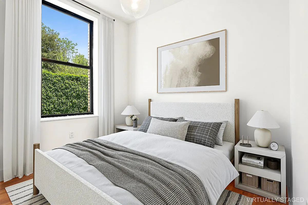 180 Bainbridge Street, Unit 311 Brooklyn, NY 11233 - Photo 4 of 21 a bedroom with a bed and a window