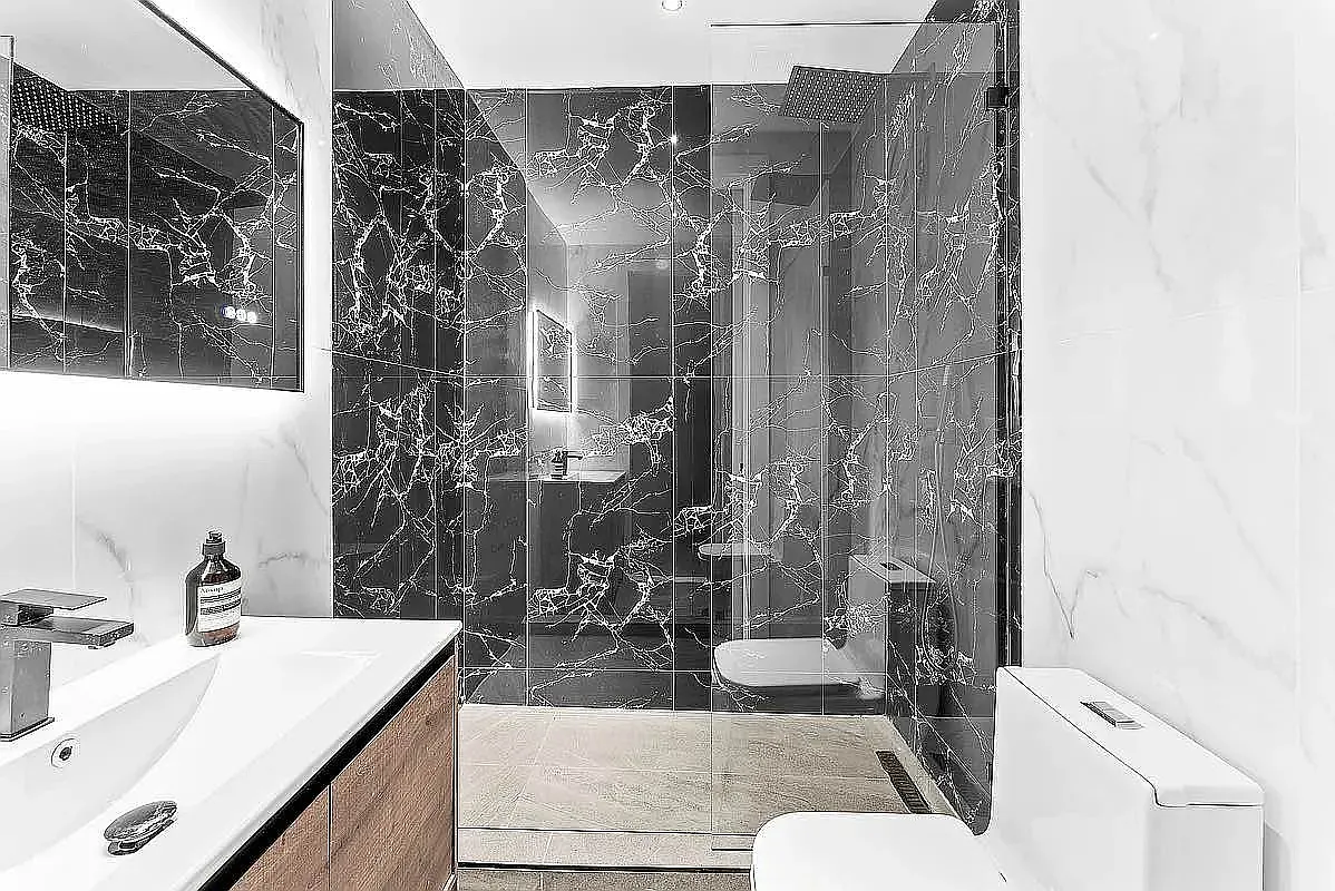 16 Barrow Street, Unit 4B Manhattan, NY 10014 - Photo 4 of 7 a bathroom with a granite countertop sink a toilet and shower