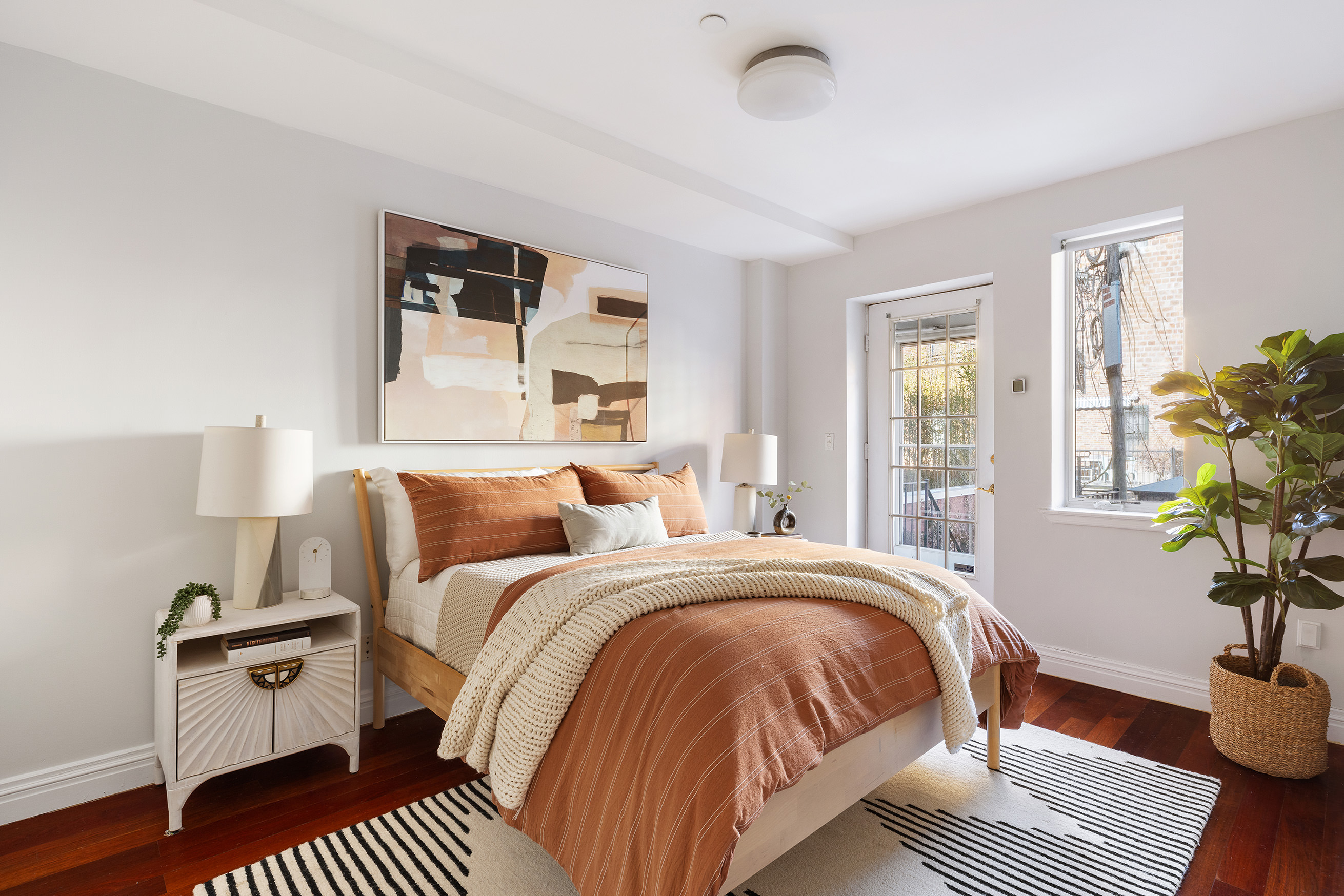 301 Warren Street, Unit 2 Brooklyn, NY 11201 - Photo 6 of 11 a bedroom with bed and a potted plant