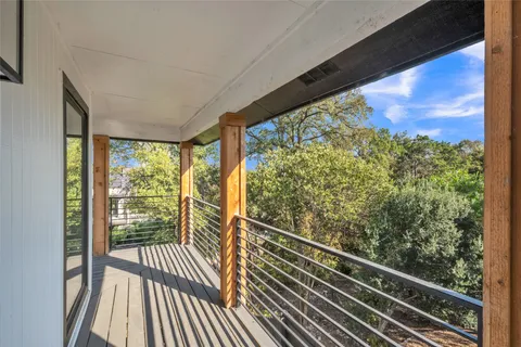a view of a balcony with wooden floor