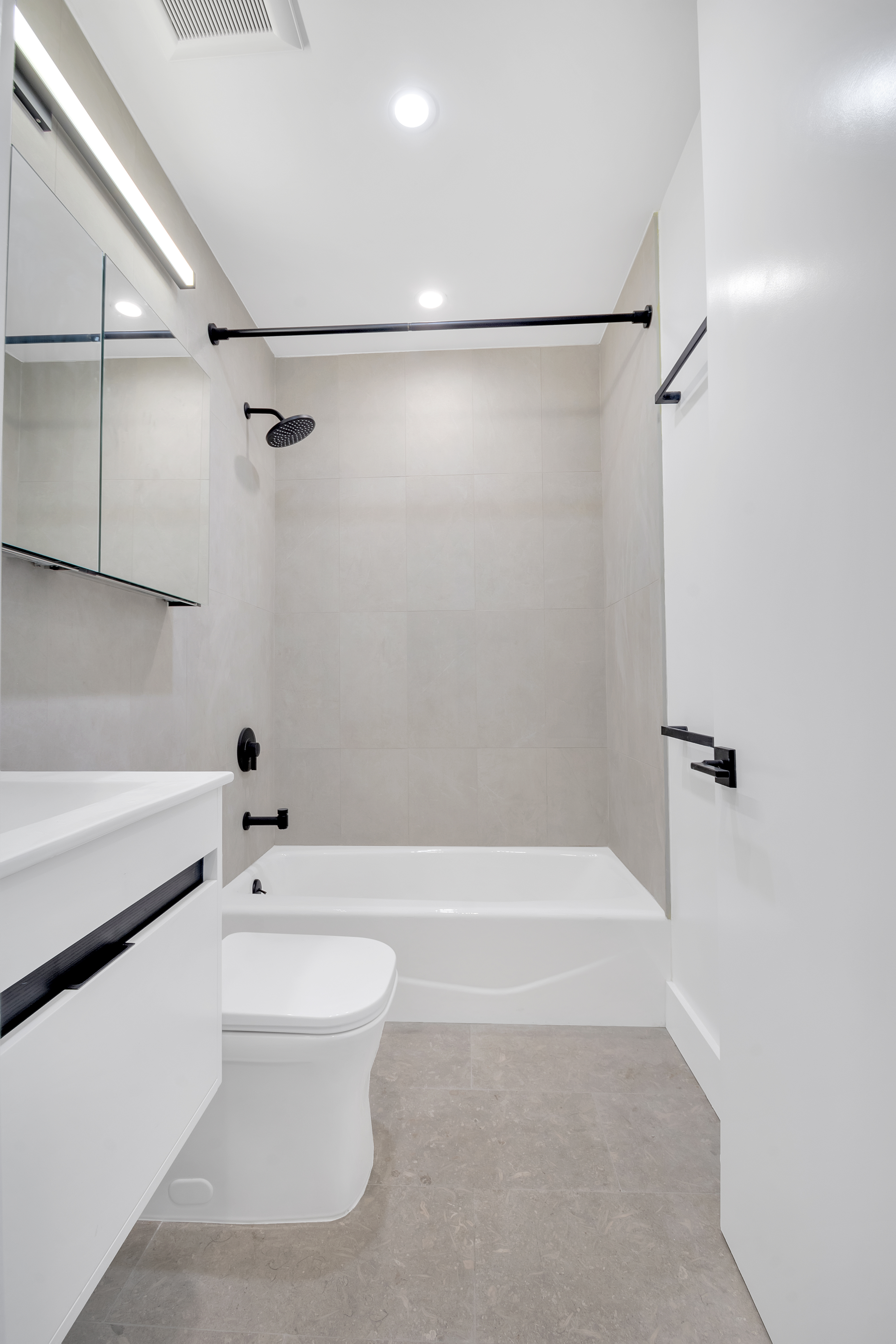 45 2nd Avenue, Unit 5 Manhattan, NY 10003 - Photo 7 of 8 a bathroom with a bathtub and a shower