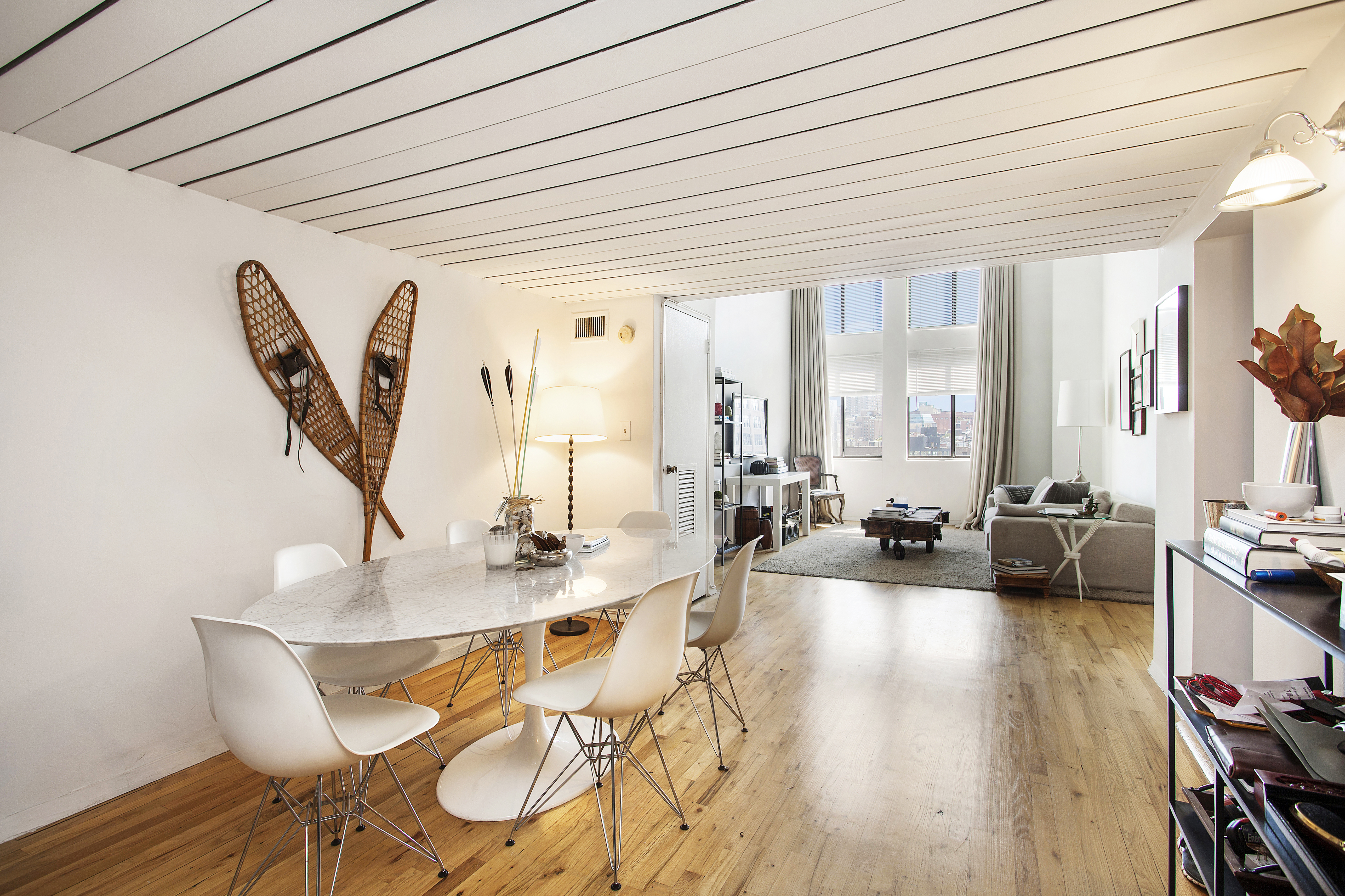 421 Hudson Street, Unit 508 Manhattan, NY 10014 - Photo 1 of 5 a dining room with furniture and wooden floor