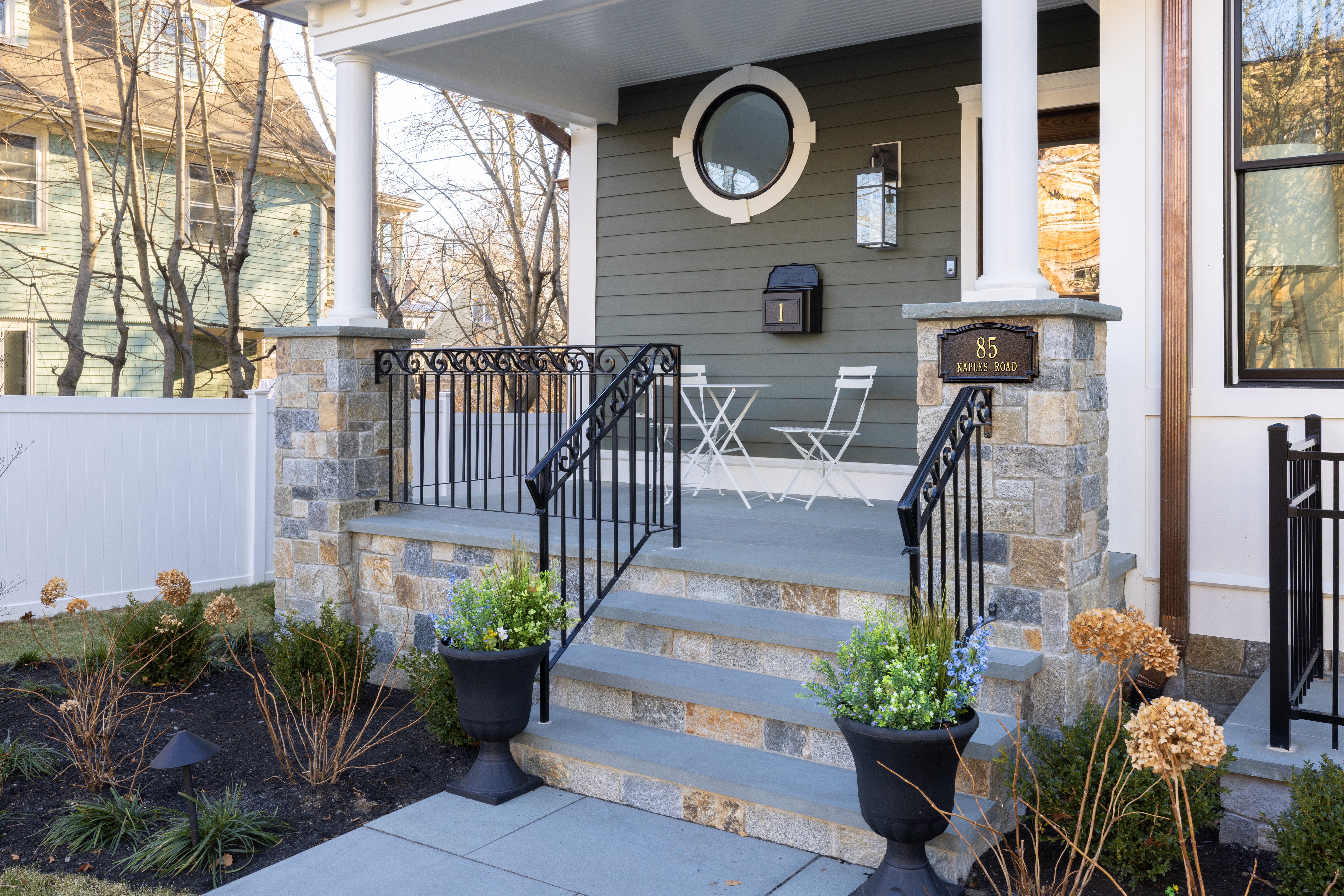 85 Naples Road Brookline, MA 02446 - Photo 34 of 36 a front view of a house having patio