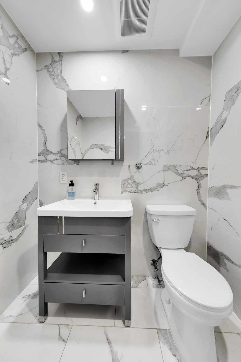 278 Nassau Avenue, Unit 4 Brooklyn, NY 11222 - Photo 16 of 17 a bathroom with a sink toilet and a mirror