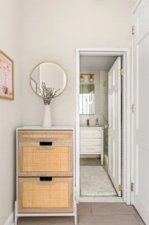 a bathroom with a sink toilet and mirror