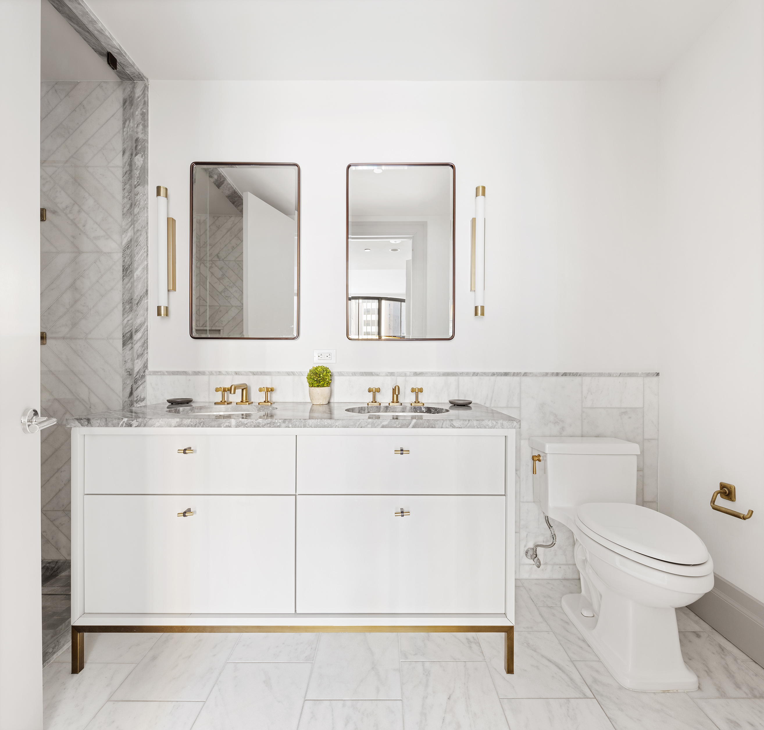 76 Schermerhorn Street, Unit 2C Brooklyn, NY 11201 - Photo 6 of 16 a bathroom with a sink vanity mirror and toilet