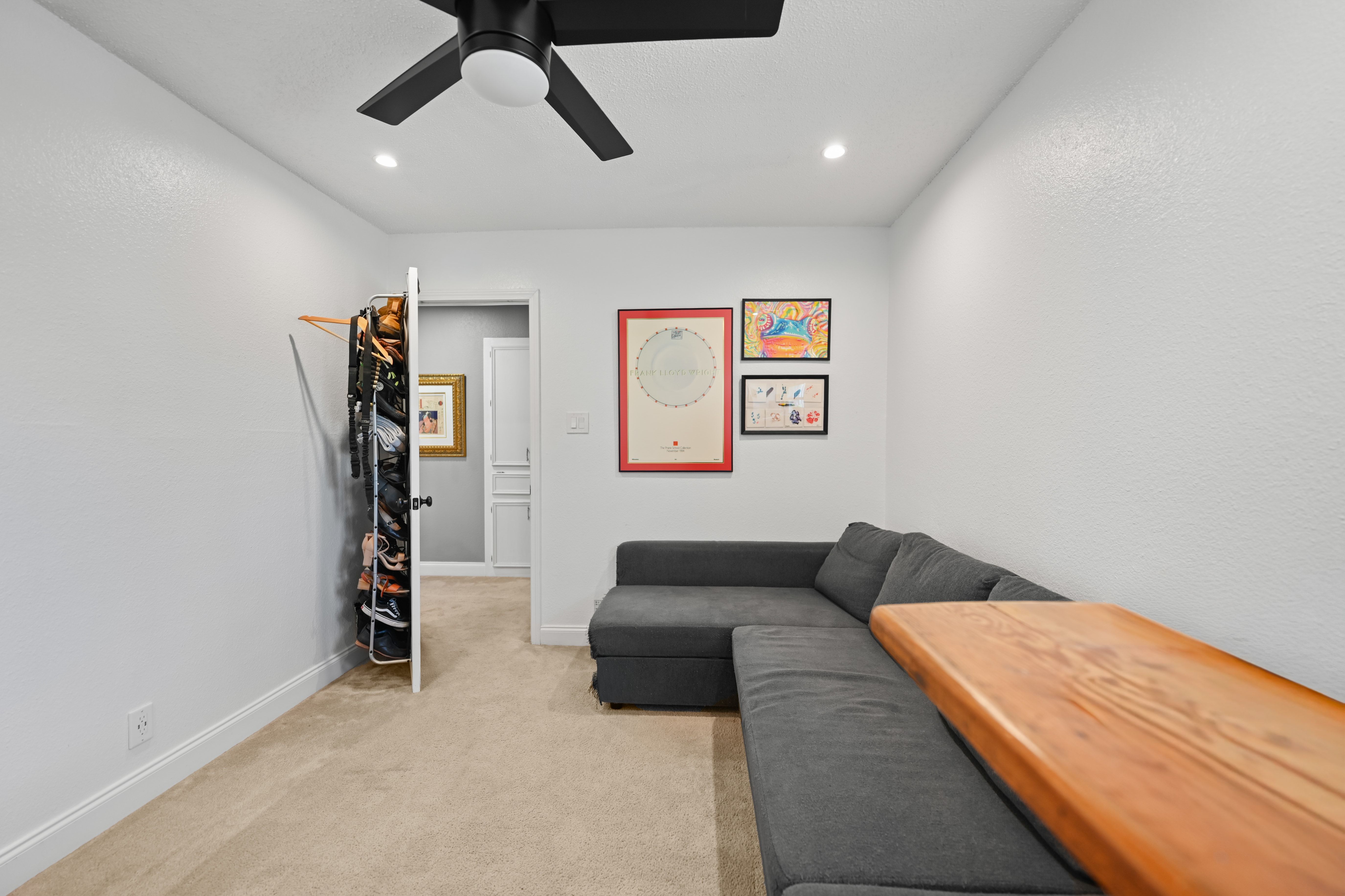 8710 Clearbrook Trail Austin, TX 78729 - Photo 9 of 28 a bedroom with furniture and a ceiling fan