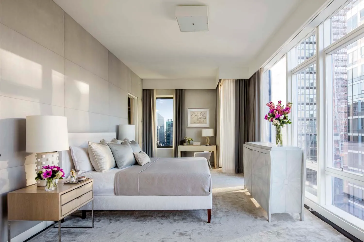 a living room with furniture and flowers