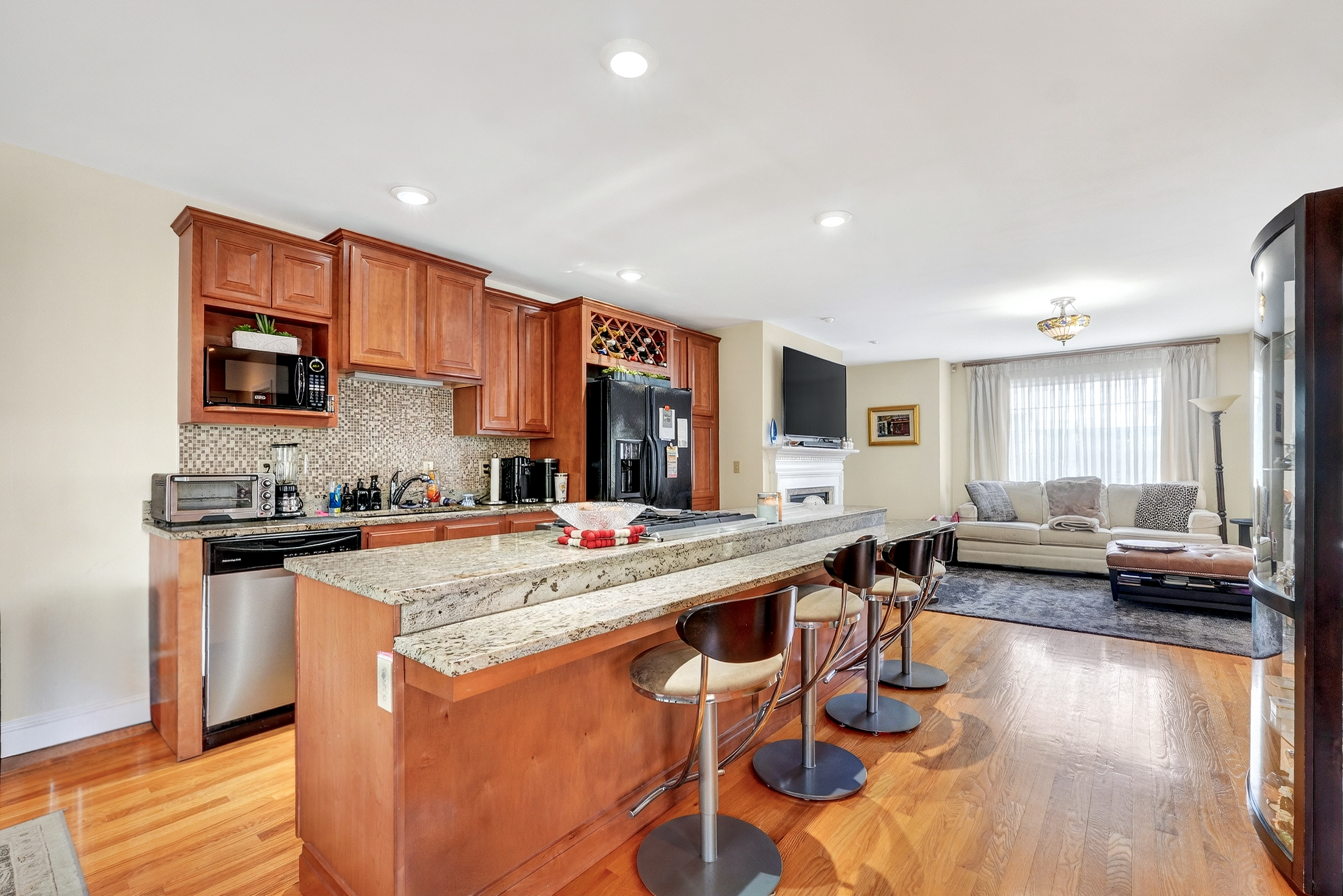 58 Tanglewood Road Newton Center, MA 02459 - Photo 11 of 33 a large kitchen with a table and chairs