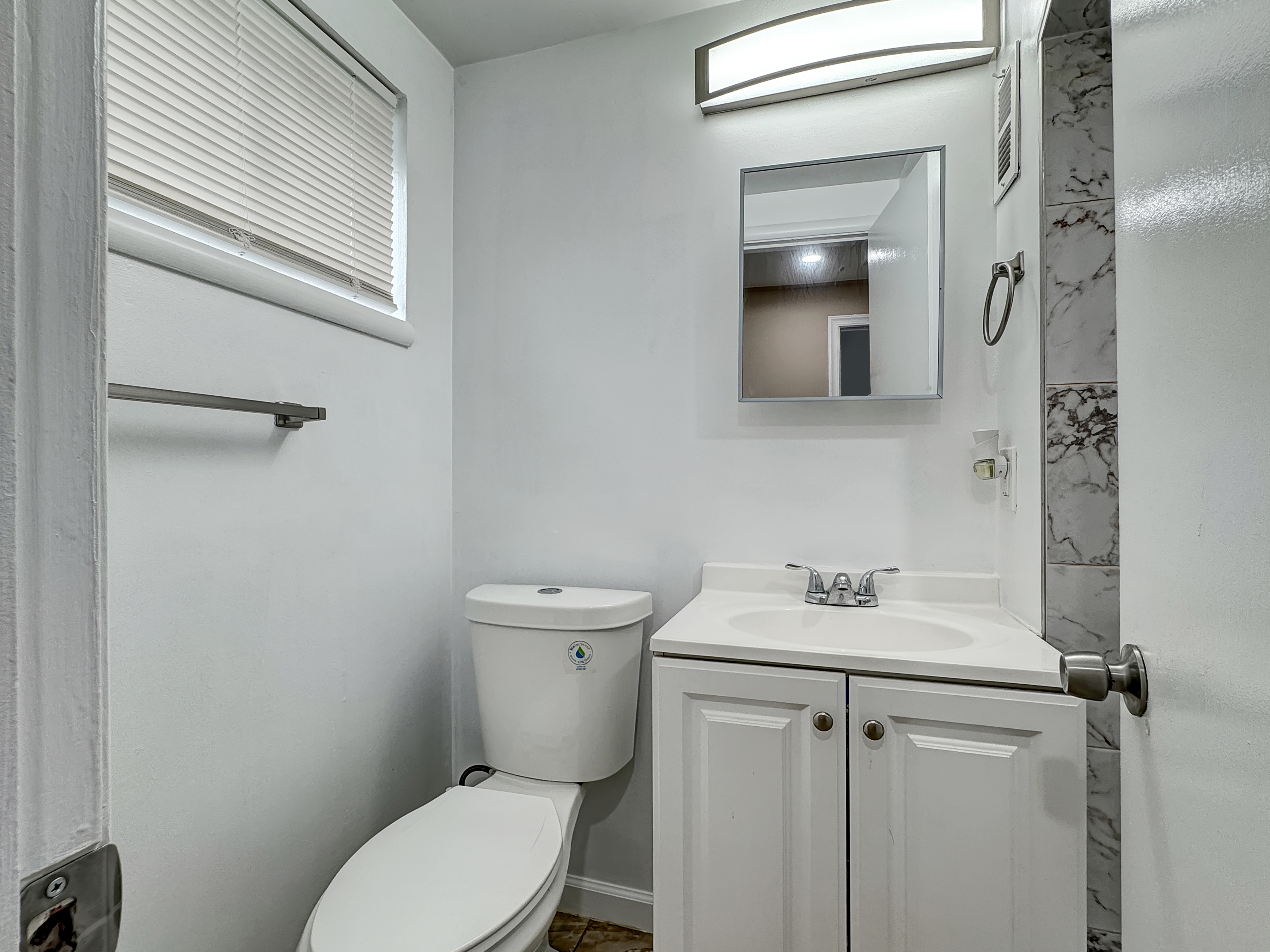 2408 Lillian Drive Silver Spring, MD 20902 - Photo 26 of 40 a bathroom with a toilet sink and mirror