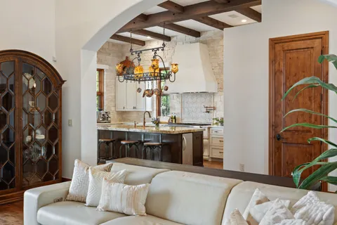 a living room with patio furniture and a fireplace