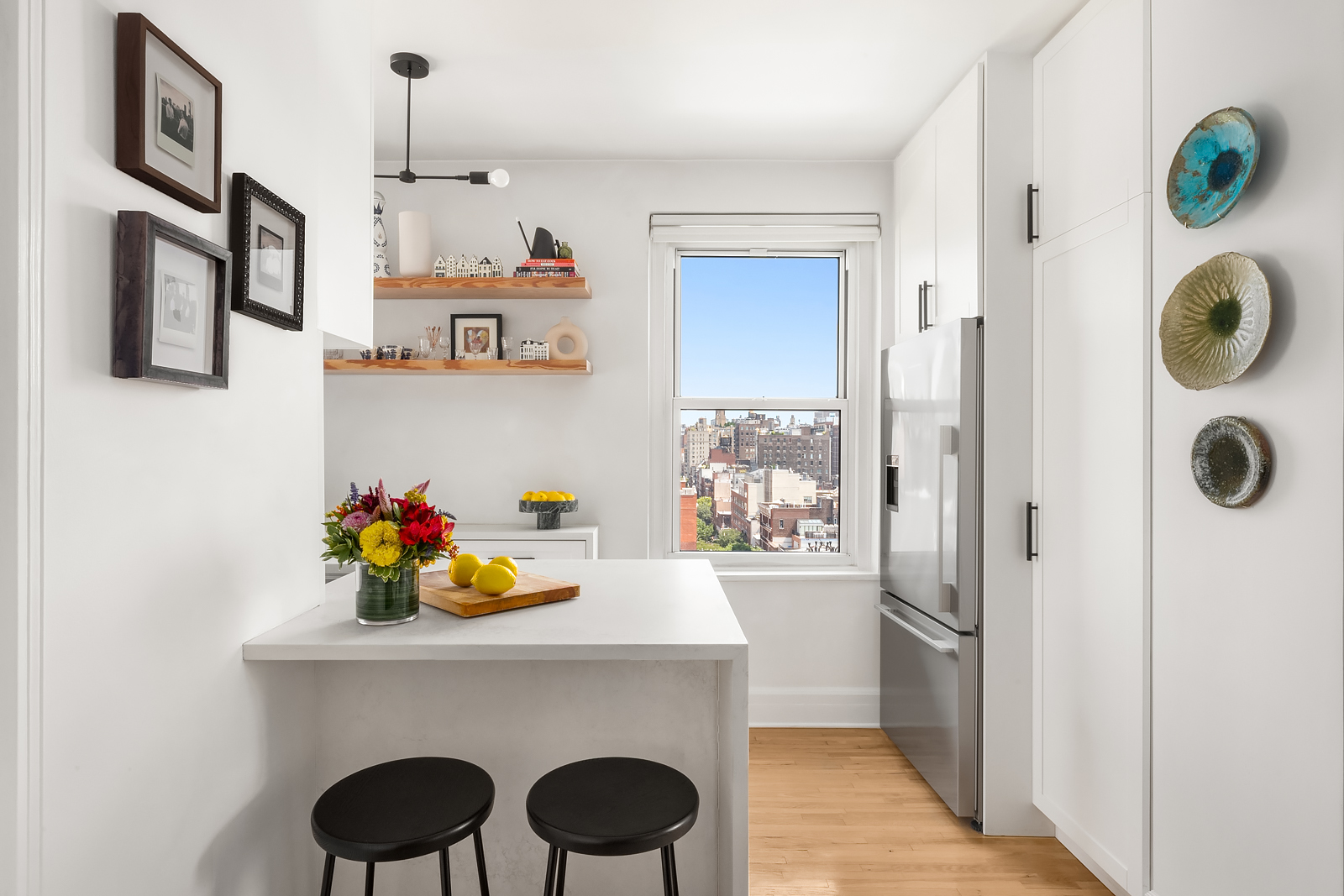 365 West 20th Street, Unit 14B Manhattan, NY 10011 - Photo 8 of 21 a kitchen with a sink a stove and refrigerator