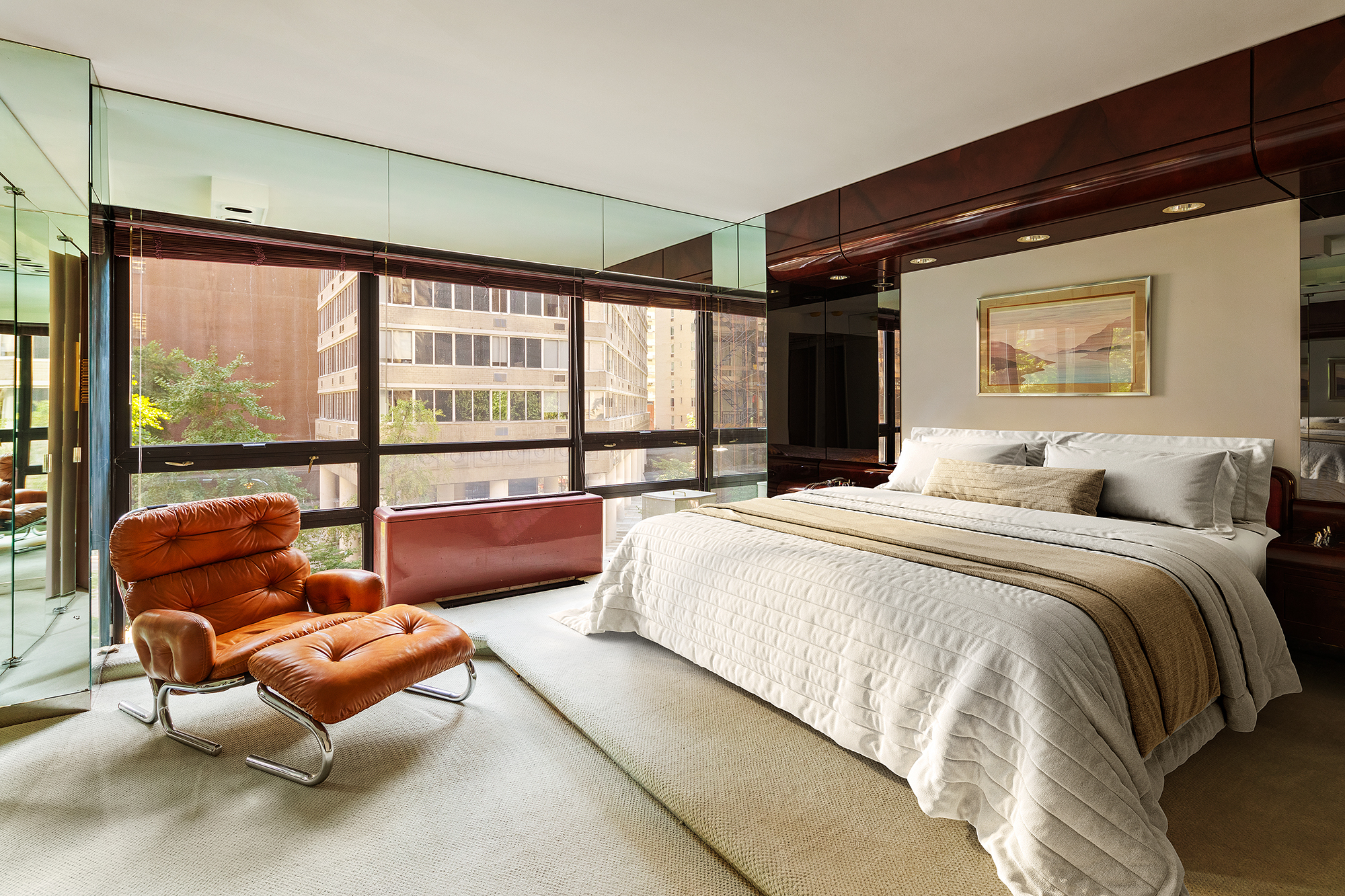 415 East 54th Street, Unit 2A Manhattan, NY 10022 - Photo 7 of 16 a spacious bedroom with a bed and glass window