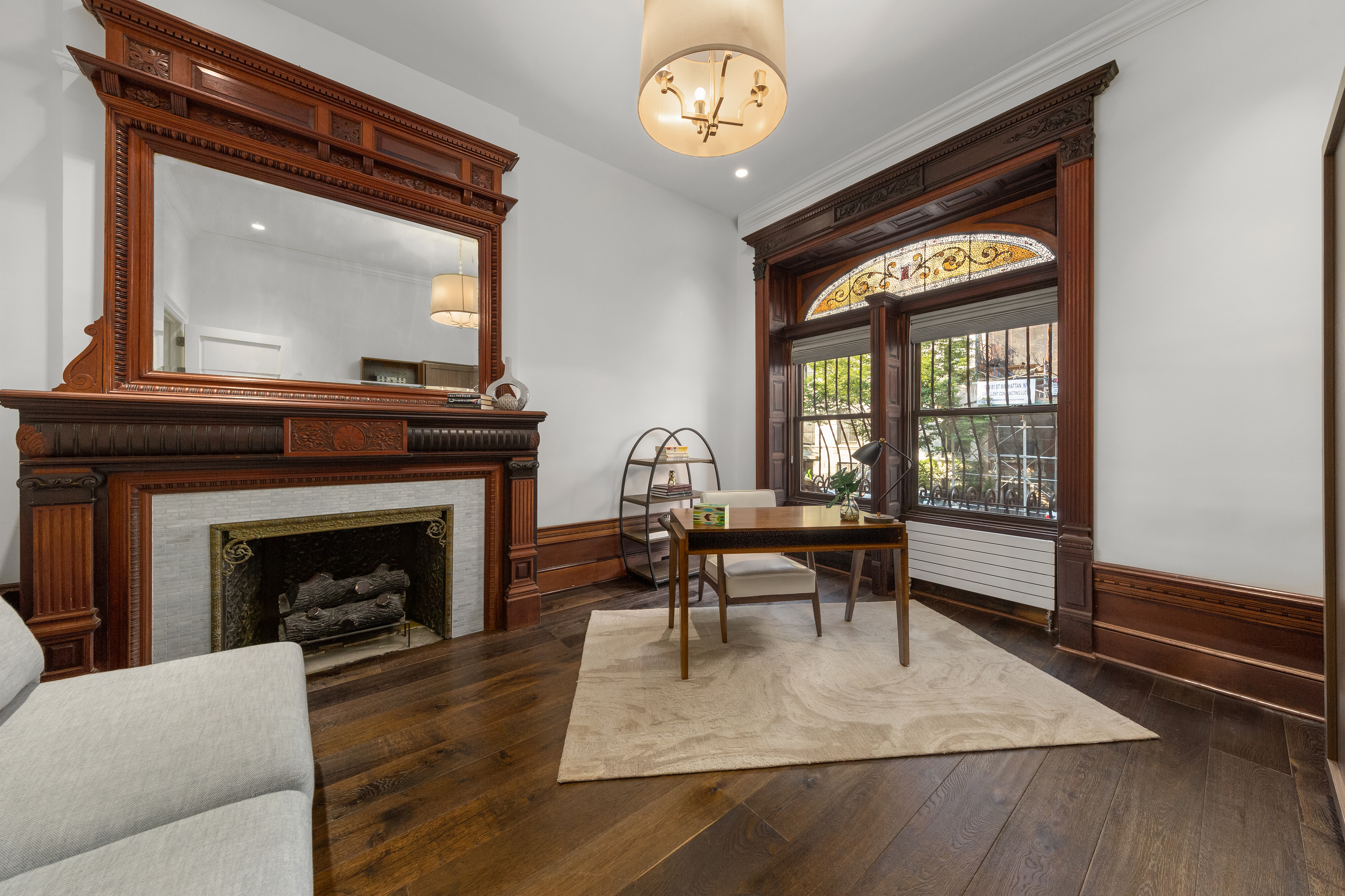 110 West 81st Street Manhattan, NY 10024 - Photo 10 of 30 a living room with furniture and a fireplace