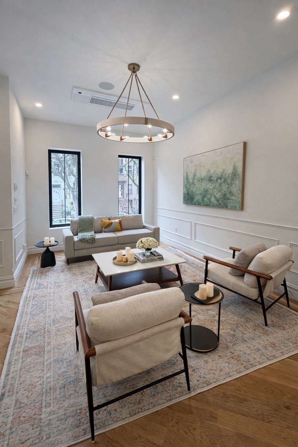 608 Van Buren Street, Unit TWH Brooklyn, NY 11221 - Photo 2 of 15 a living room with furniture and a chandelier