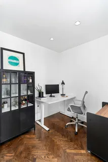 a view of a workspace with furniture