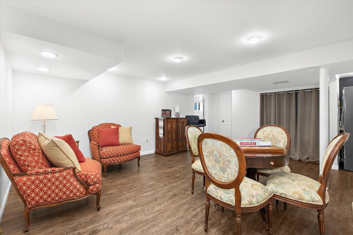 12712 Atherton Drive Silver Spring, MD 20906 - Photo 26 of 40 a living room with furniture a rug and wooden floor