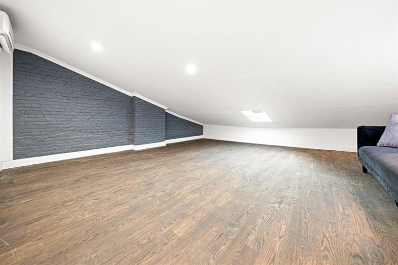 308 Clifton Place Brooklyn, NY 11216 - Photo 29 of 41 a view of an empty room with wooden floor