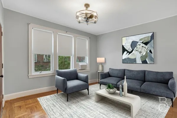 a living room with furniture and a window