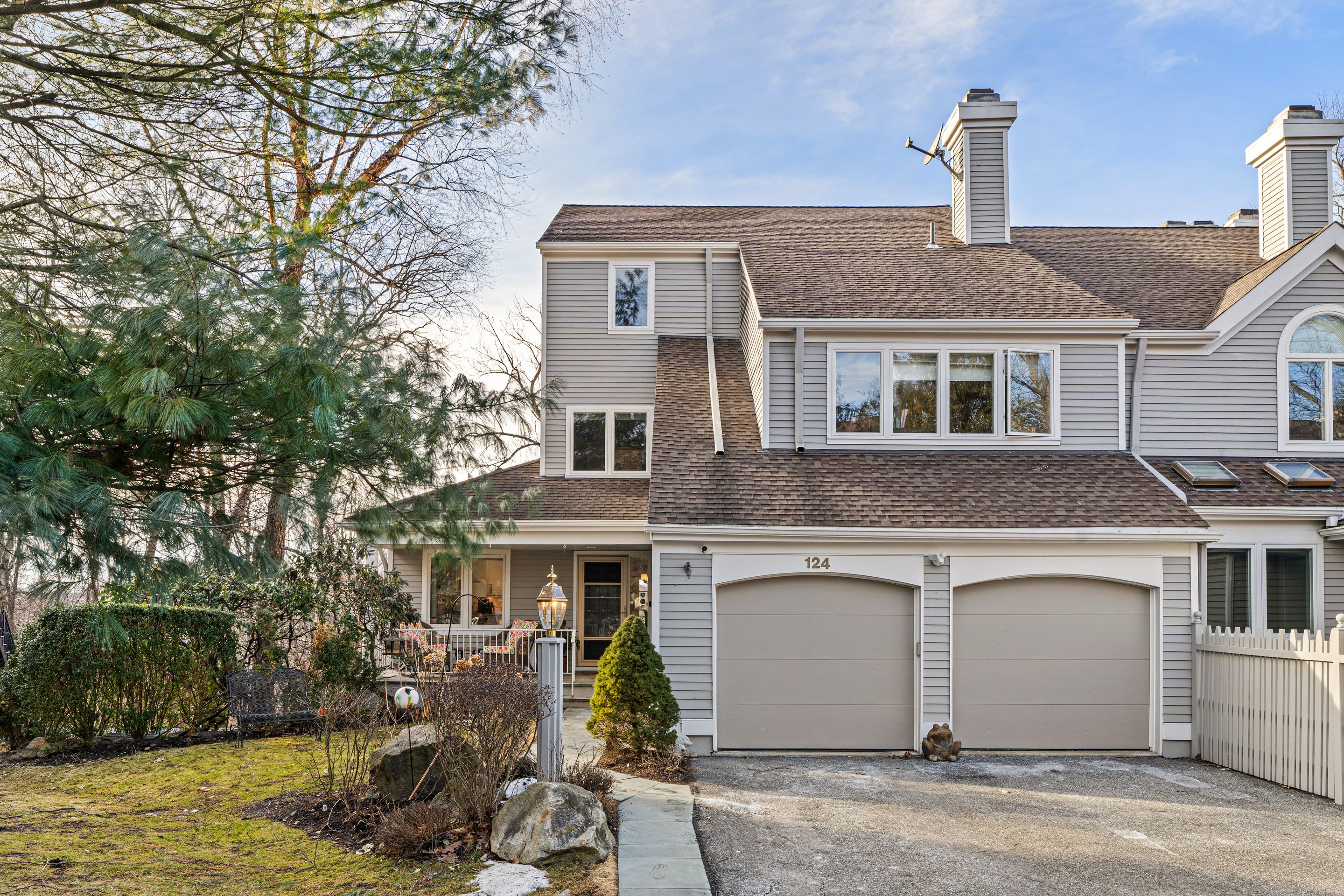 124 Boulder Ridge Road Scarsdale, NY 10583 - Photo 2 of 31 a front view of a house with a yard