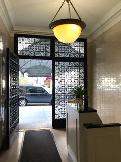 a view of a entryway door of the room