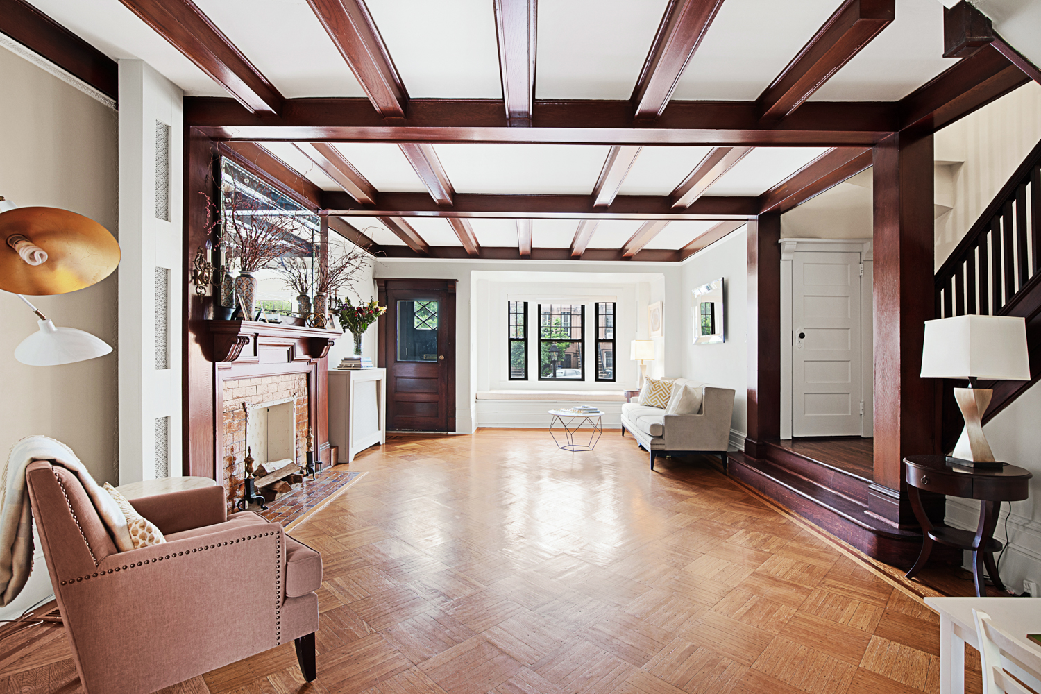 392 9th Street Brooklyn, NY 11215 - Photo 1 of 11 a living room with furniture a wooden floor and next to a window