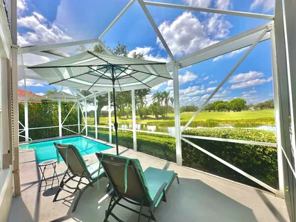 a view of a two chair in the patio next to a yard