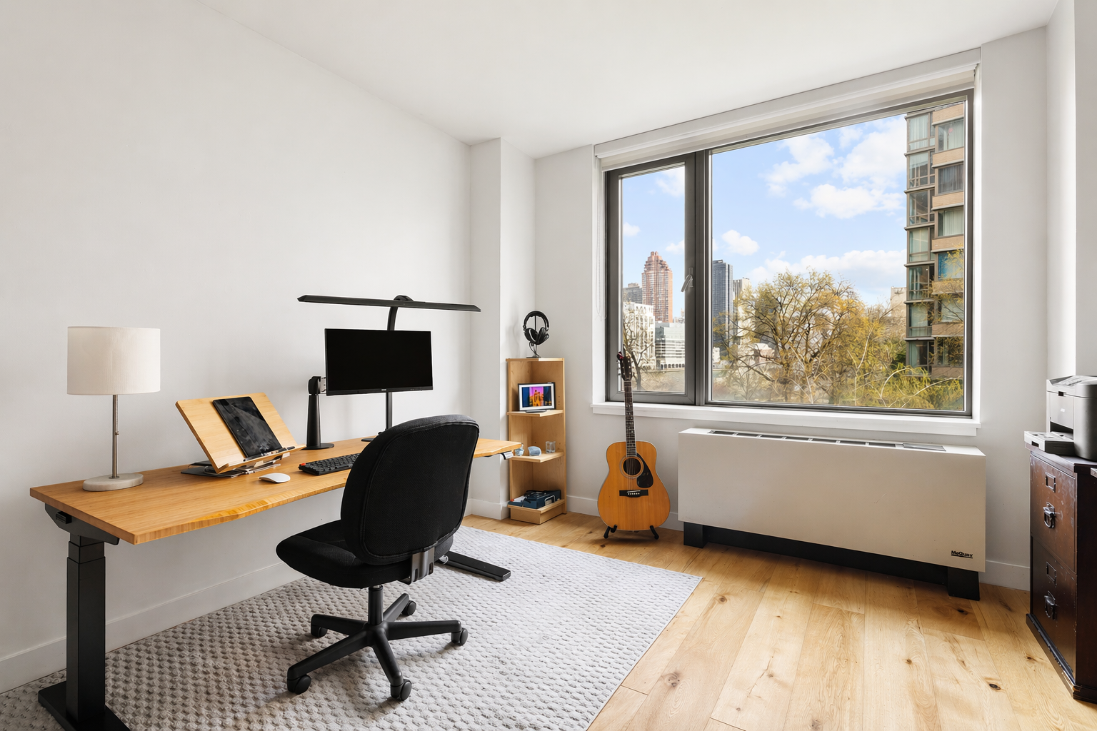 455 Main Street, Unit 4GH Manhattan, NY 10044 - Photo 6 of 9 a living room with furniture and a window