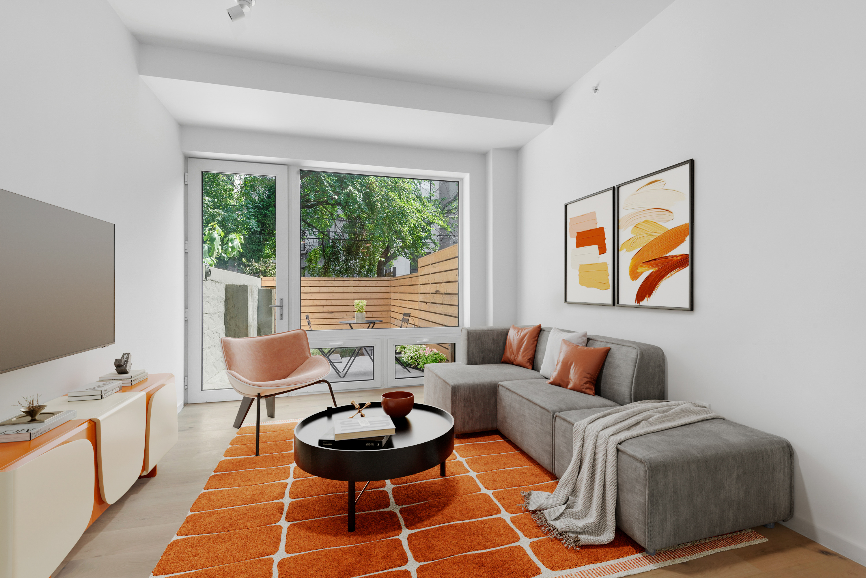 702 Hancock Street, Unit 1A Brooklyn, NY 11233 - Photo 1 of 12 a living room with furniture and a large window