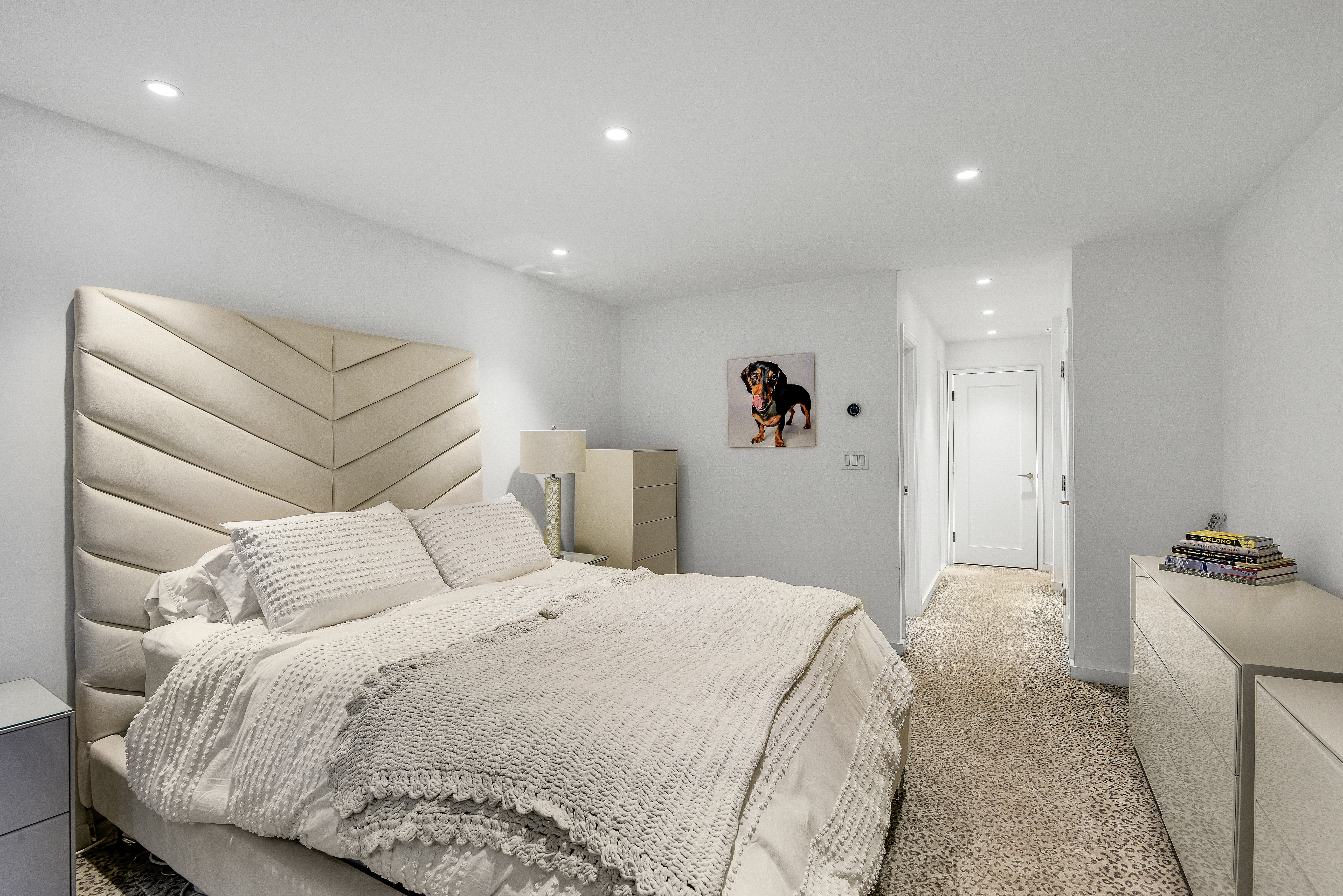 200 Central Park South, Unit 3Q Manhattan, NY 10019 - Photo 8 of 15 a bedroom with a bed and a large mirror