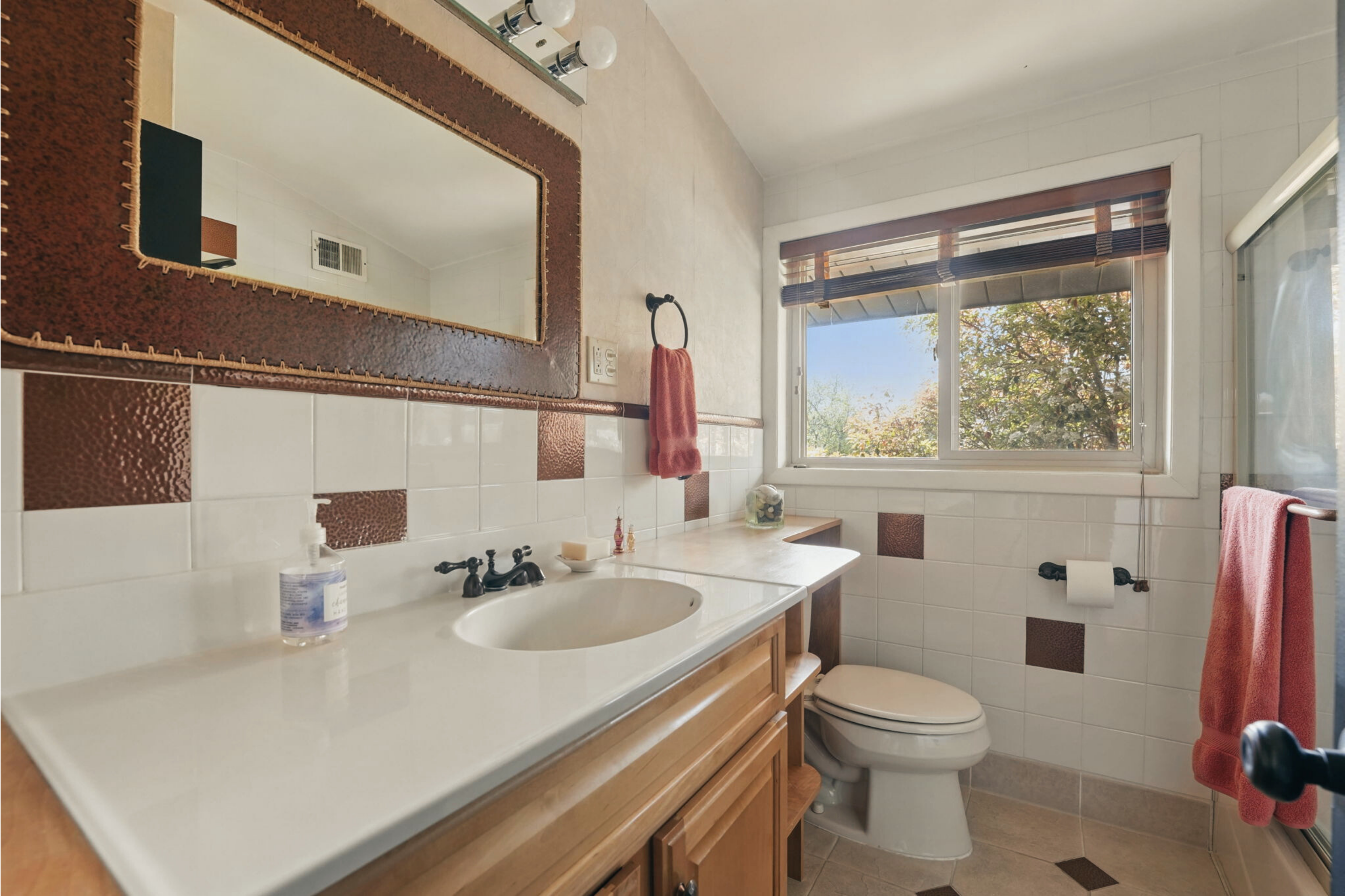 8003 16th Street Northwest Washington, DC 20012 - Photo 31 of 38 a bathroom with a sink toilet and mirror