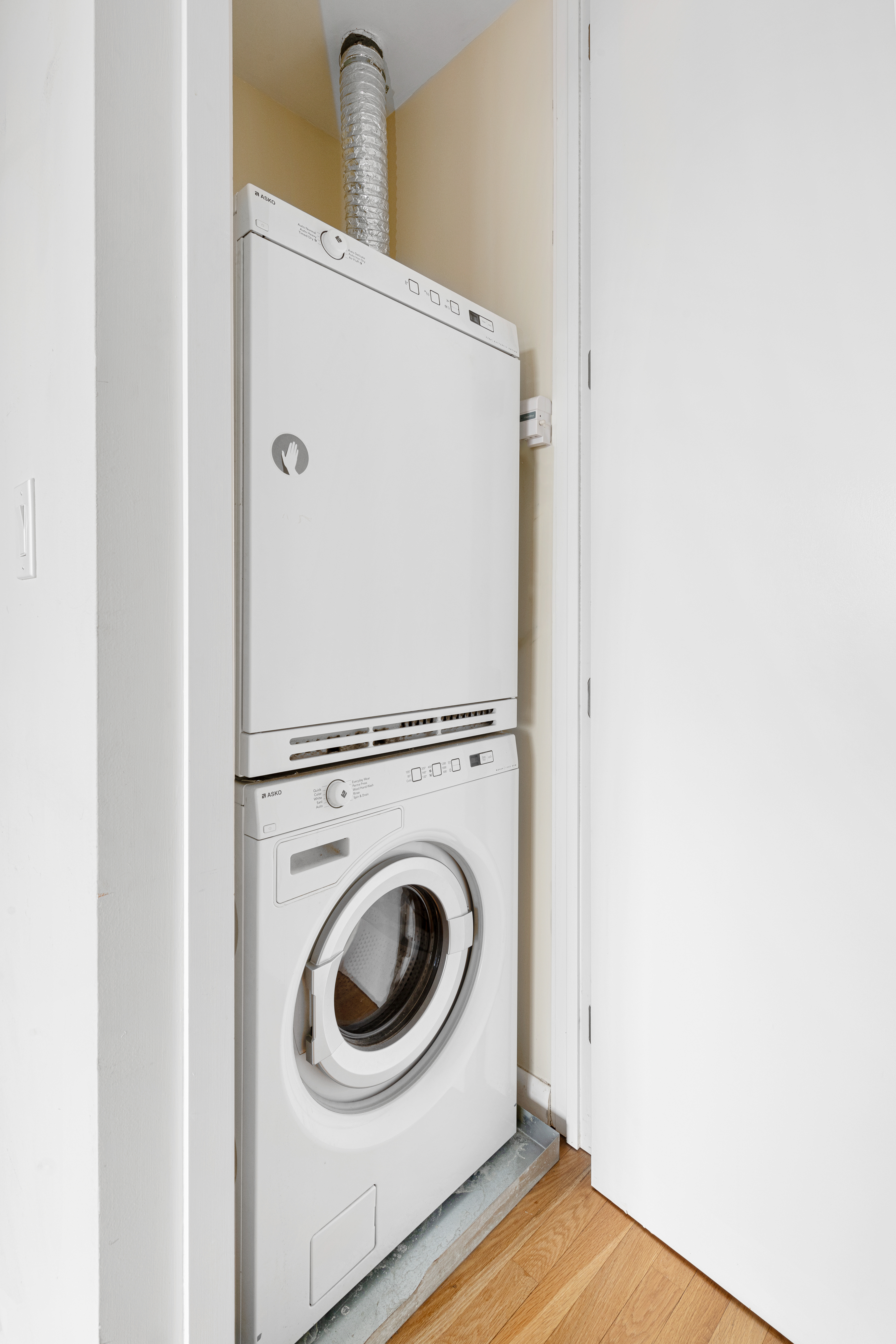 524 East 72nd Street, Unit 24A Manhattan, NY 10021 - Photo 9 of 12 a close up view of a washer and dryer