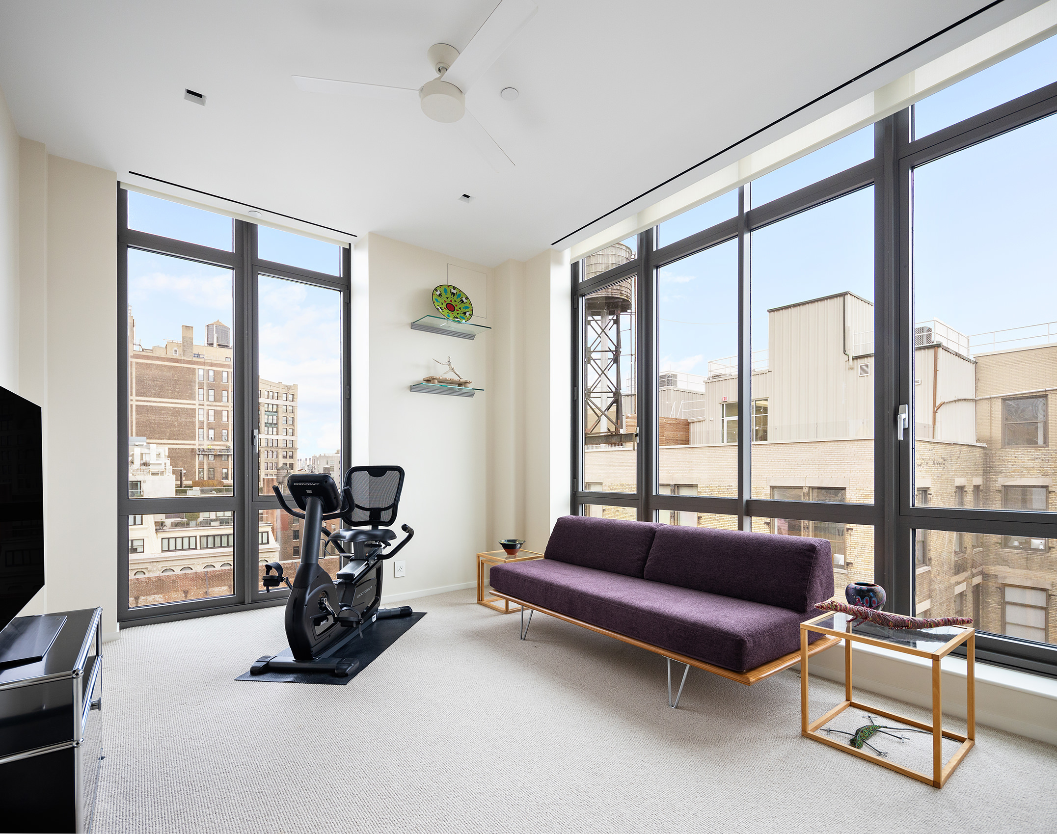4 West 21st Street, Unit PH Manhattan, NY 10010 - Photo 10 of 14 a living room with furniture and a floor to ceiling window