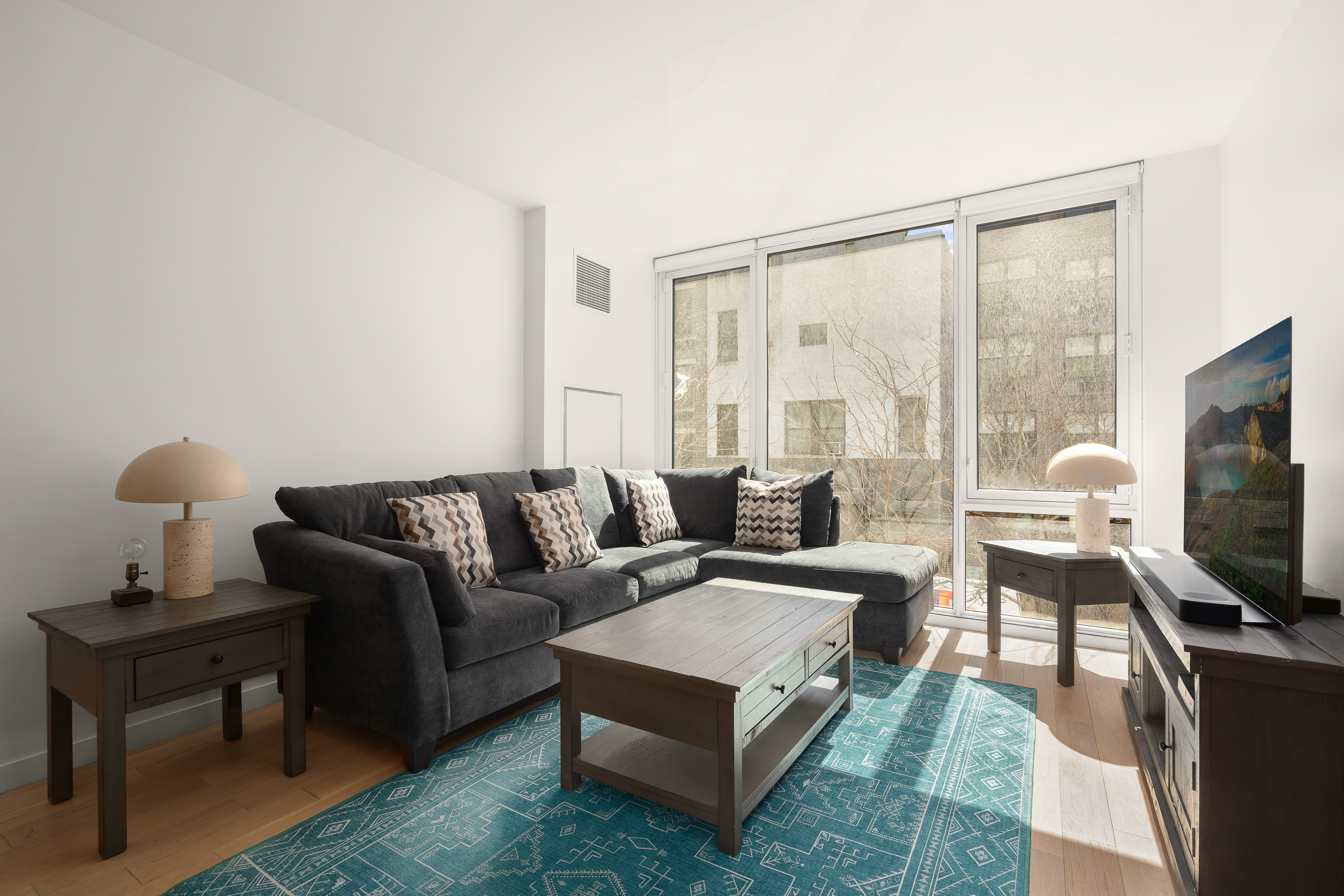 a living room with furniture and a flat screen tv