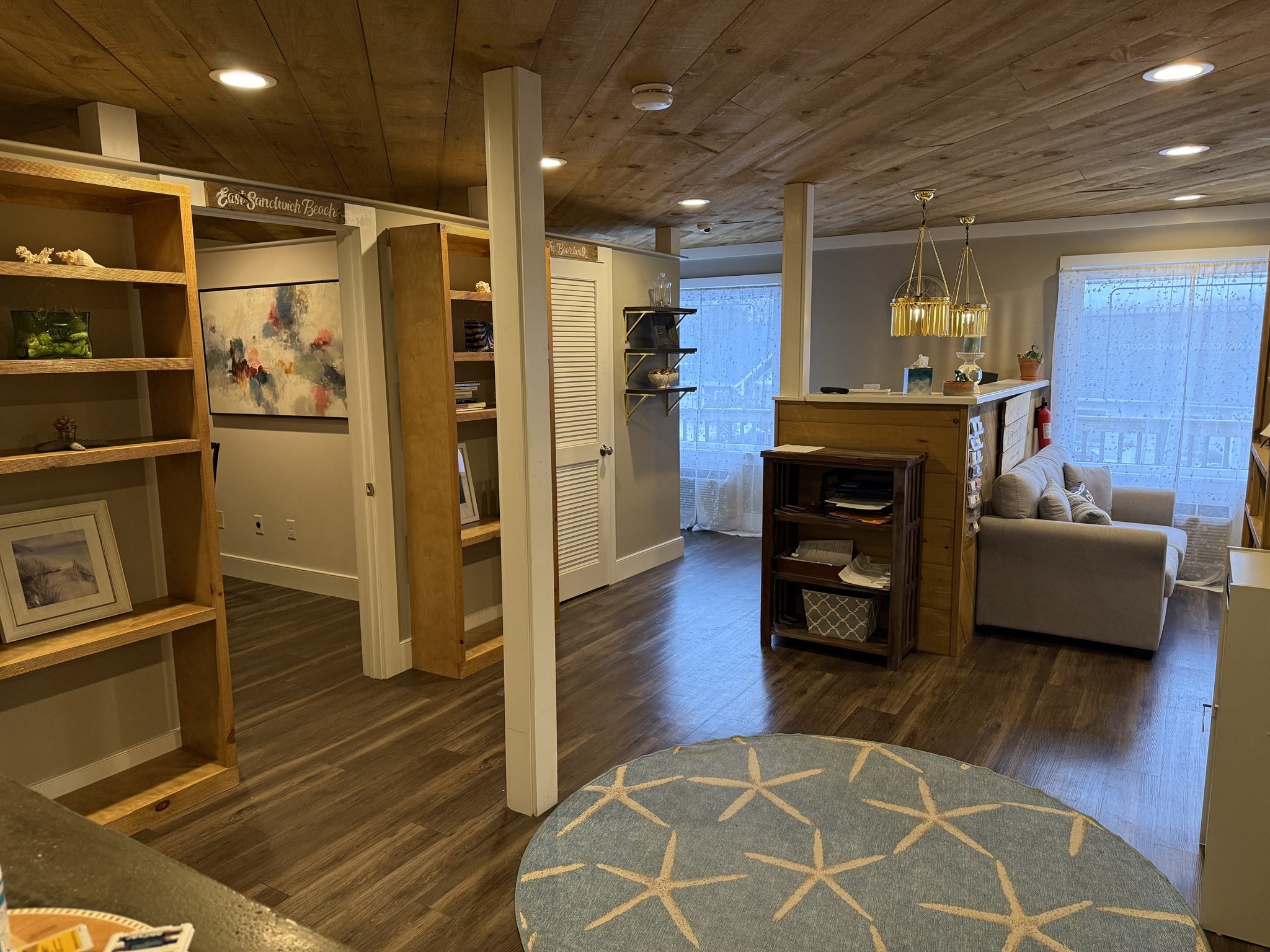 68 Tupper Road, Unit 8 Sandwich, MA 02563 - Photo 5 of 9 a living room with stainless steel appliances furniture a rug and a view of kitchen