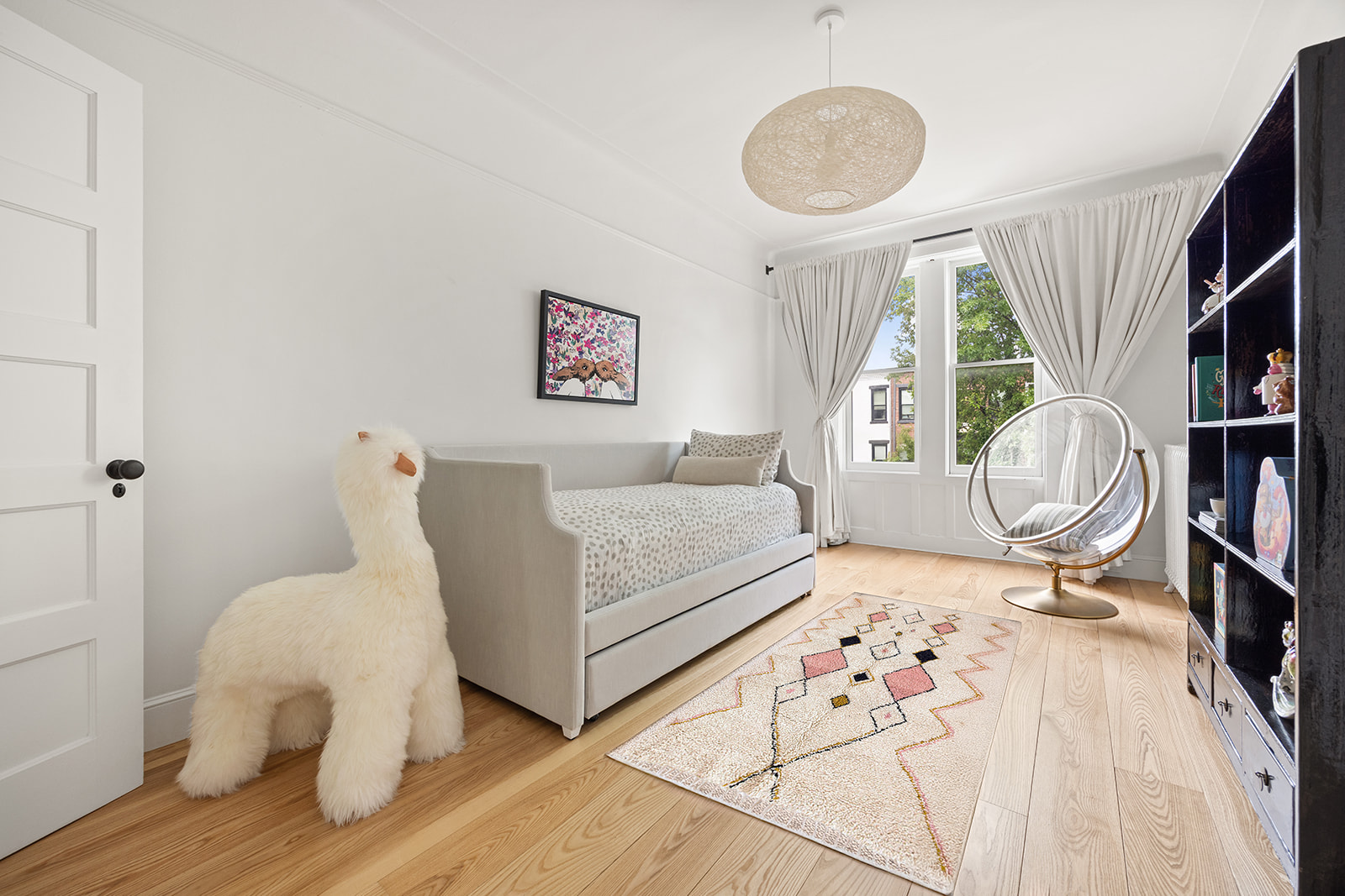 125 Rutland Road Brooklyn, NY 11225 - Photo 11 of 22 a bedroom with a bed and a large window