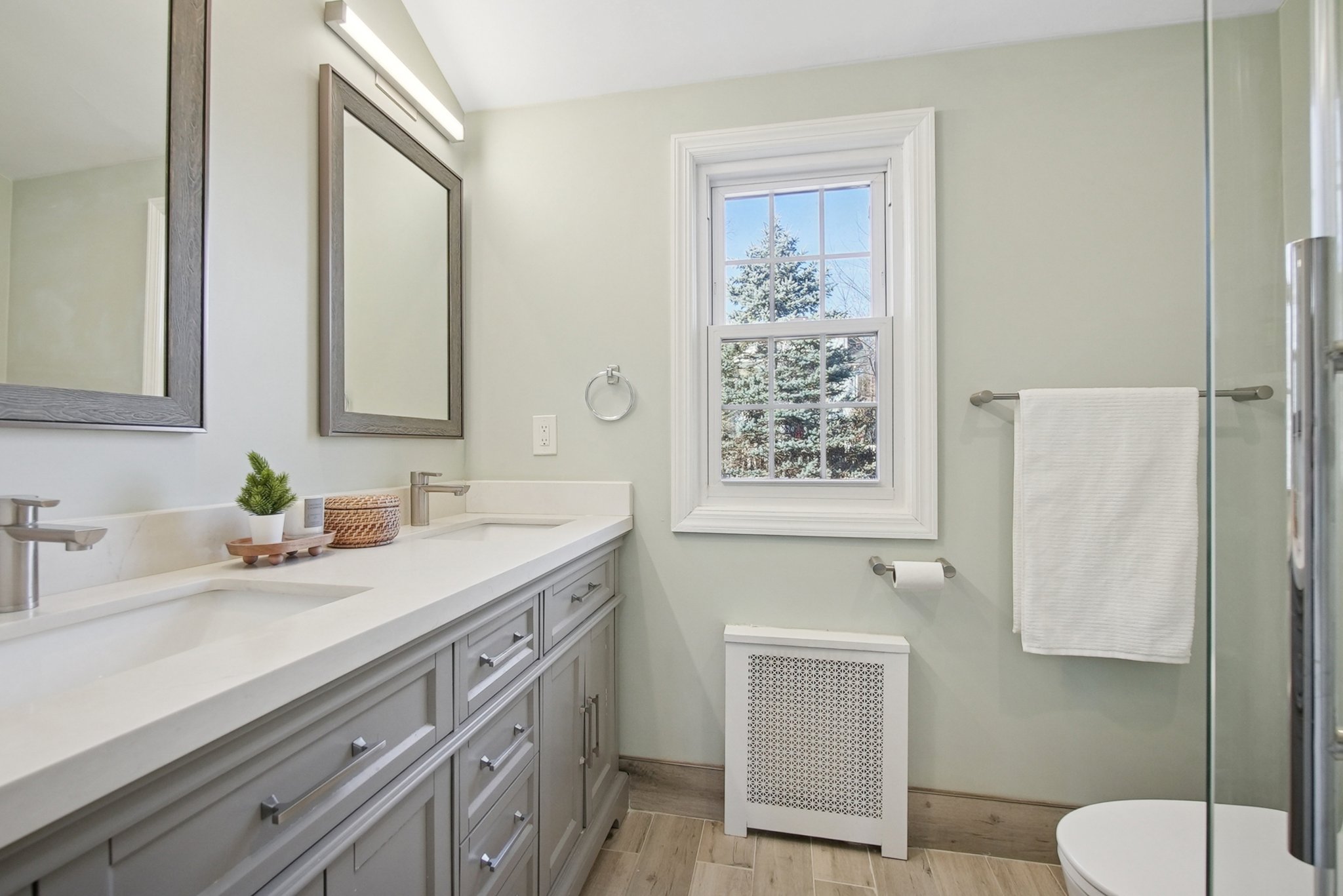 877 Ridgewood Road Millburn, NJ 07041 - Photo 18 of 37 a bathroom with a sink a toilet and mirror