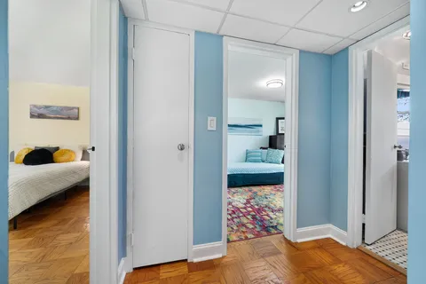 a bedroom with a bed and view of bathroom