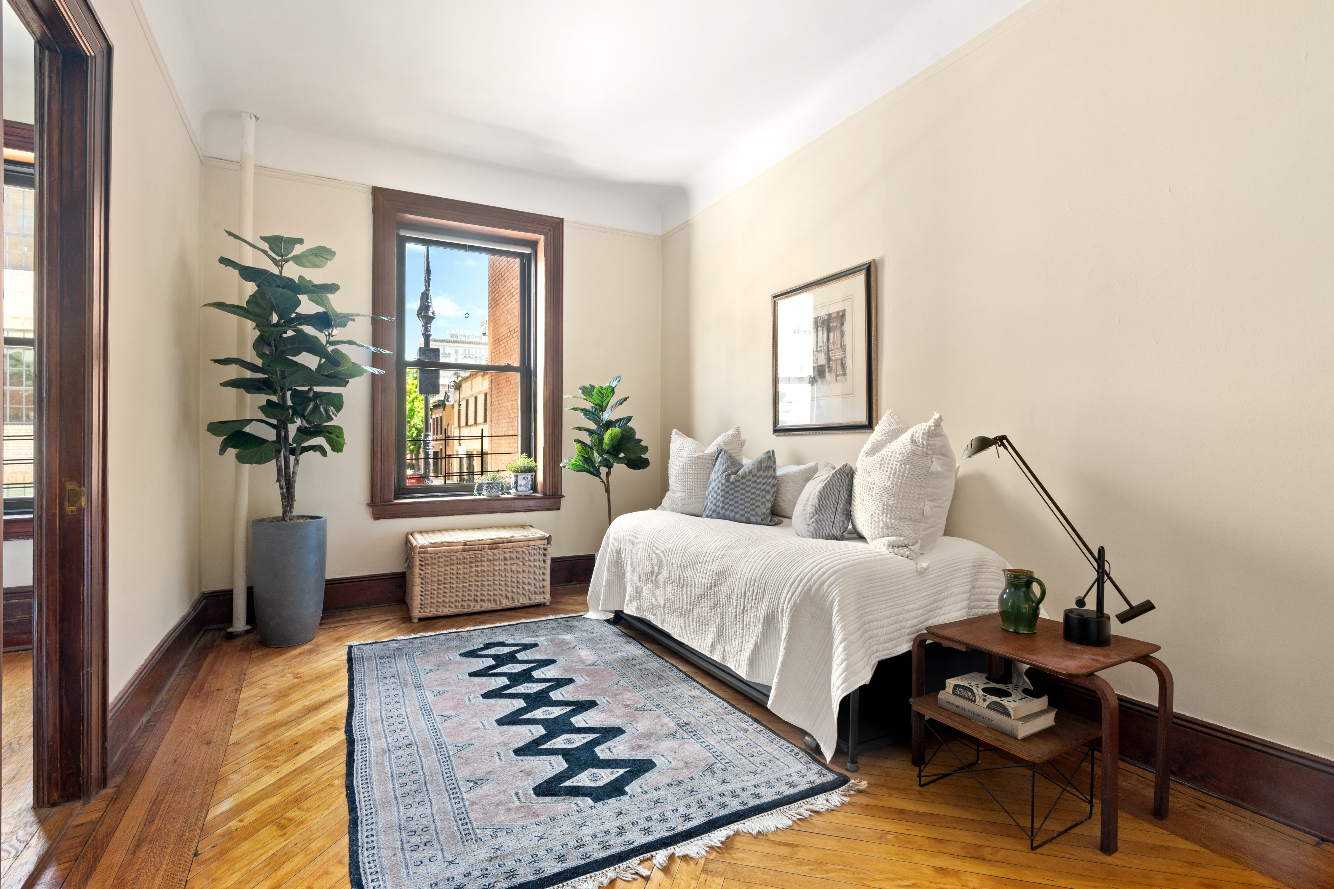 61 Pierrepont Street, Unit 24 Brooklyn, NY 11201 - Photo 7 of 11 a bedroom with furniture and a window