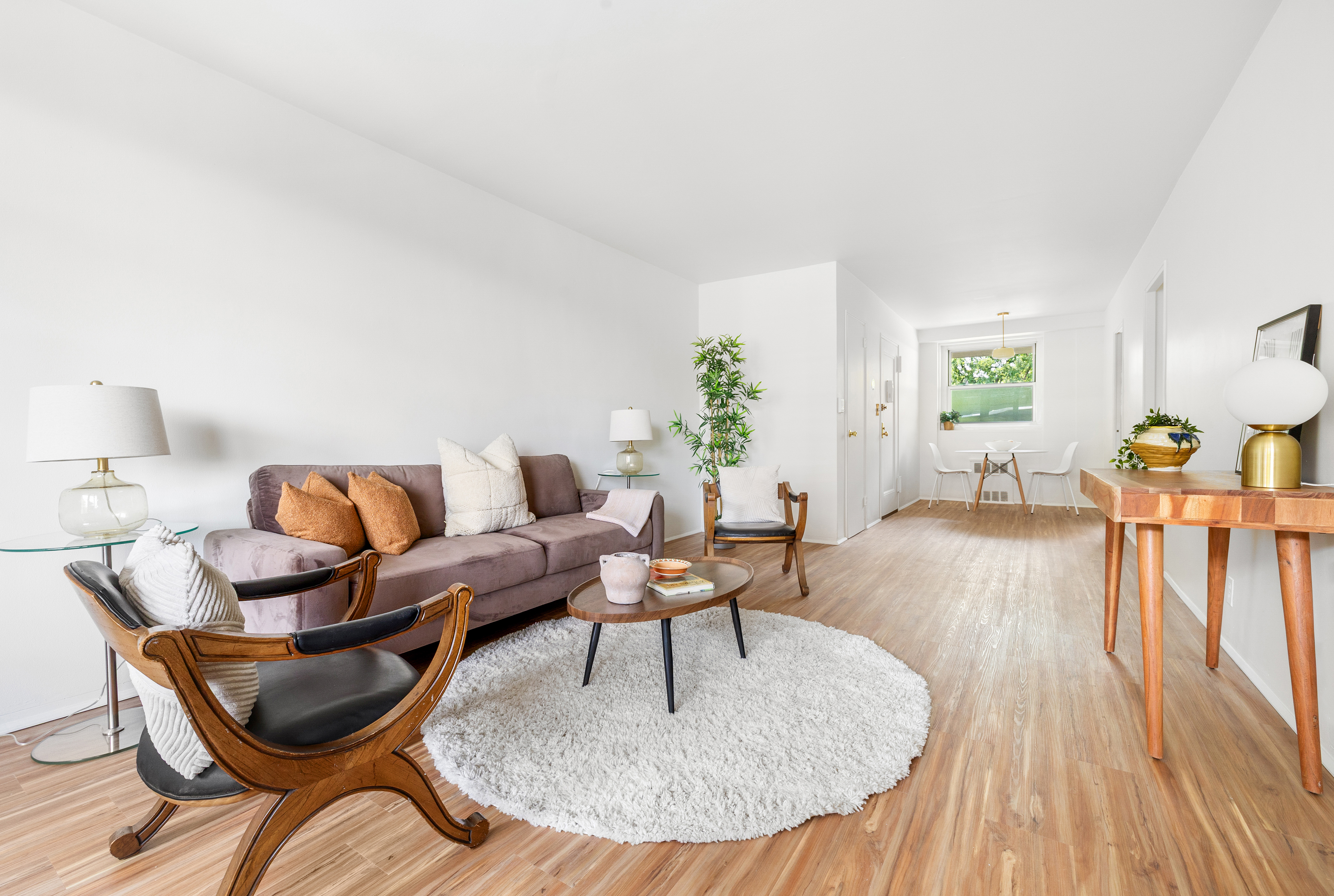 35-31 85th Street, Unit 6C Queens, NY 11372 - Photo 2 of 11 a living room with furniture and wooden floor