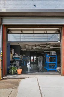 an outdoor view of shop with a outdoor seating