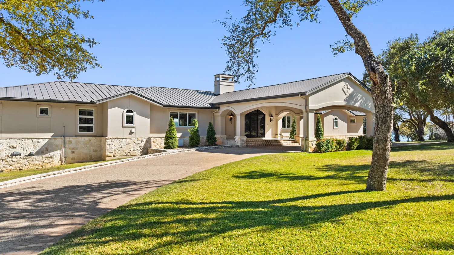 a swimming pool with trees in front of it