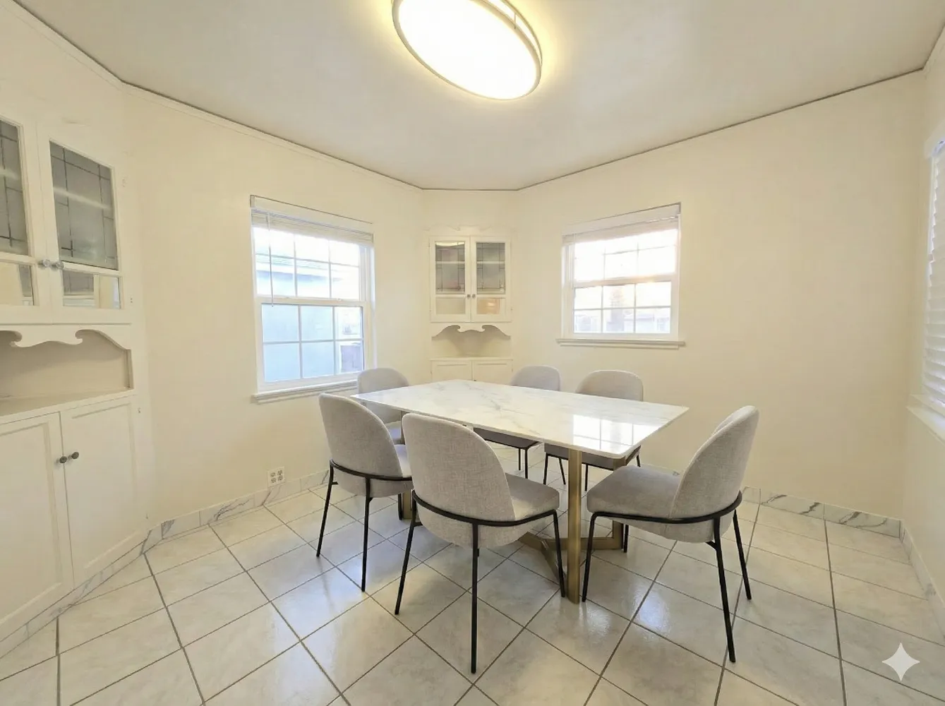 a view of a dining room with furniture and window