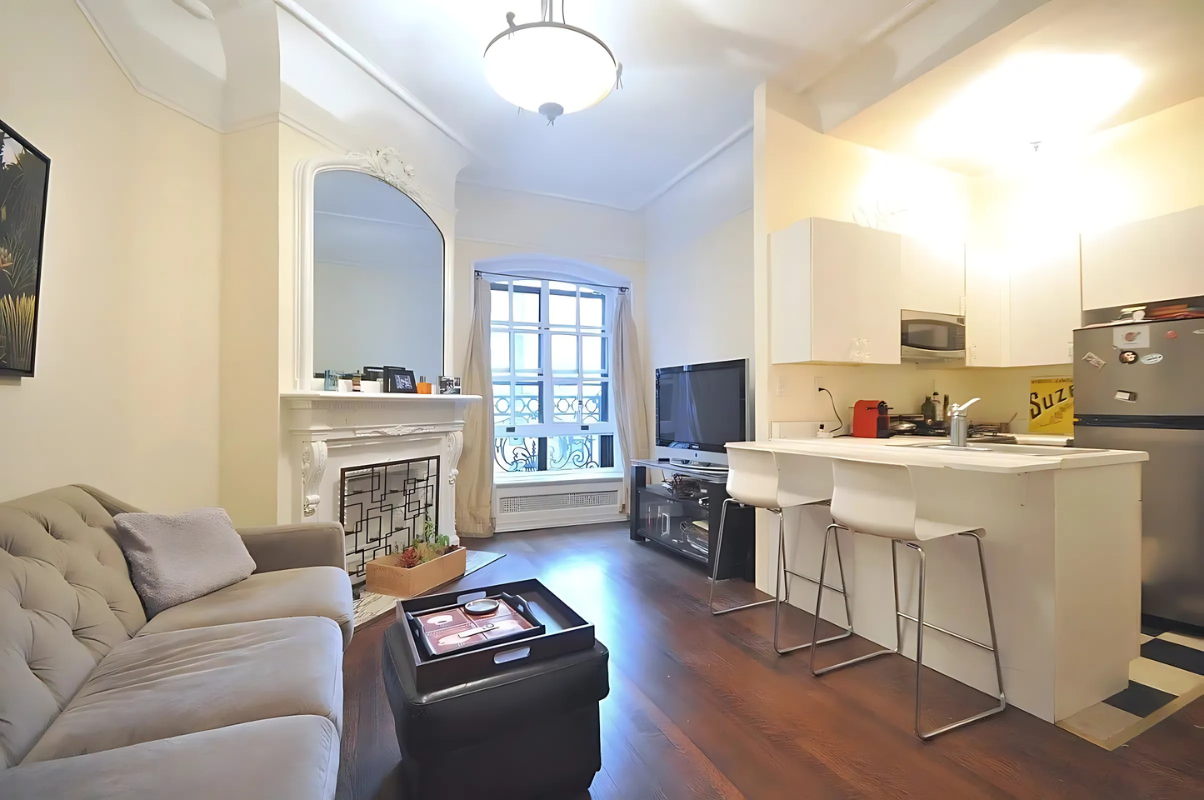 2109 Broadway, Unit 531 Manhattan, NY 10023 - Photo 2 of 8 a living room with furniture and a fireplace