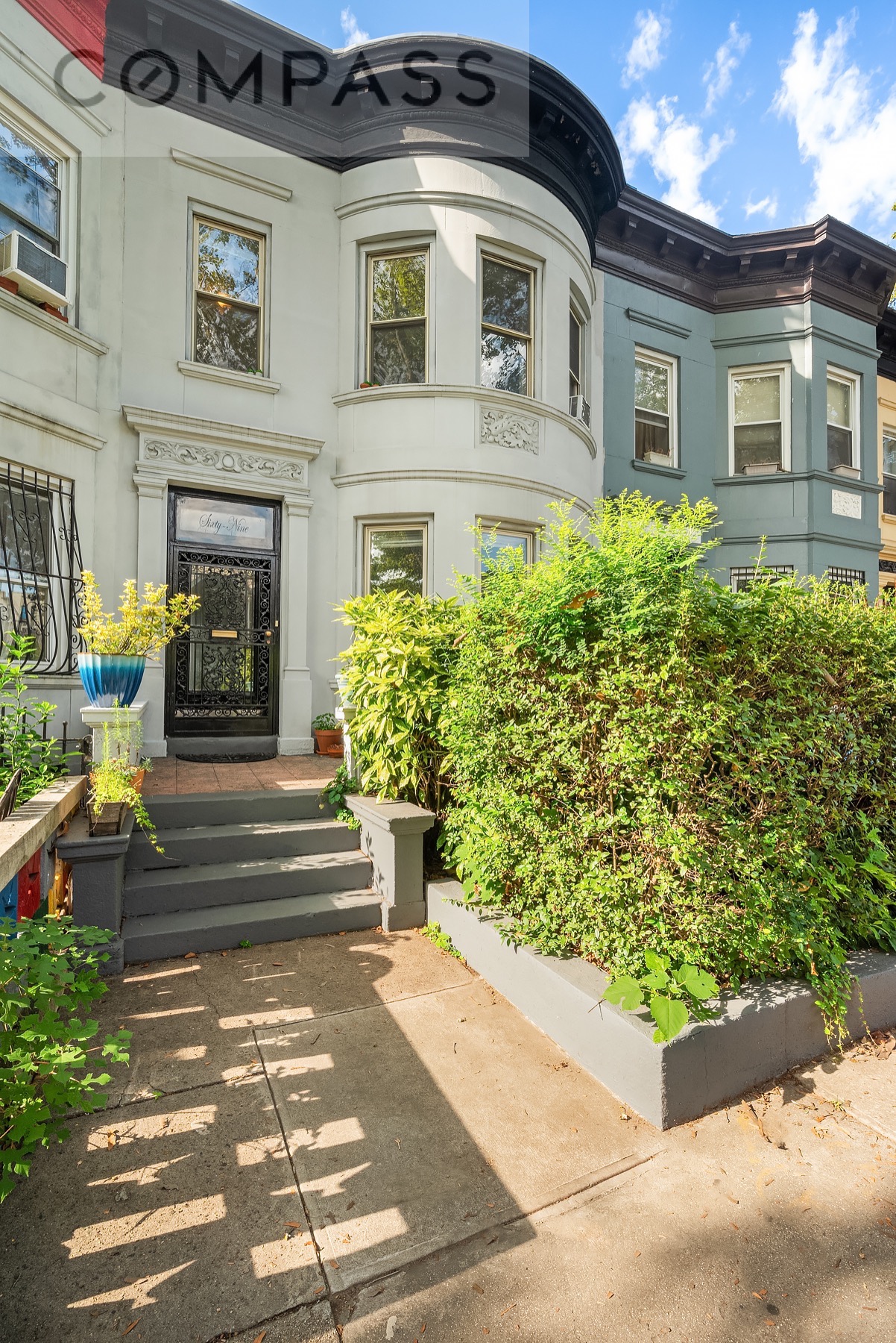 69 Sterling Street Brooklyn, NY 11225 - Photo 14 of 14 a front view of a house with garden