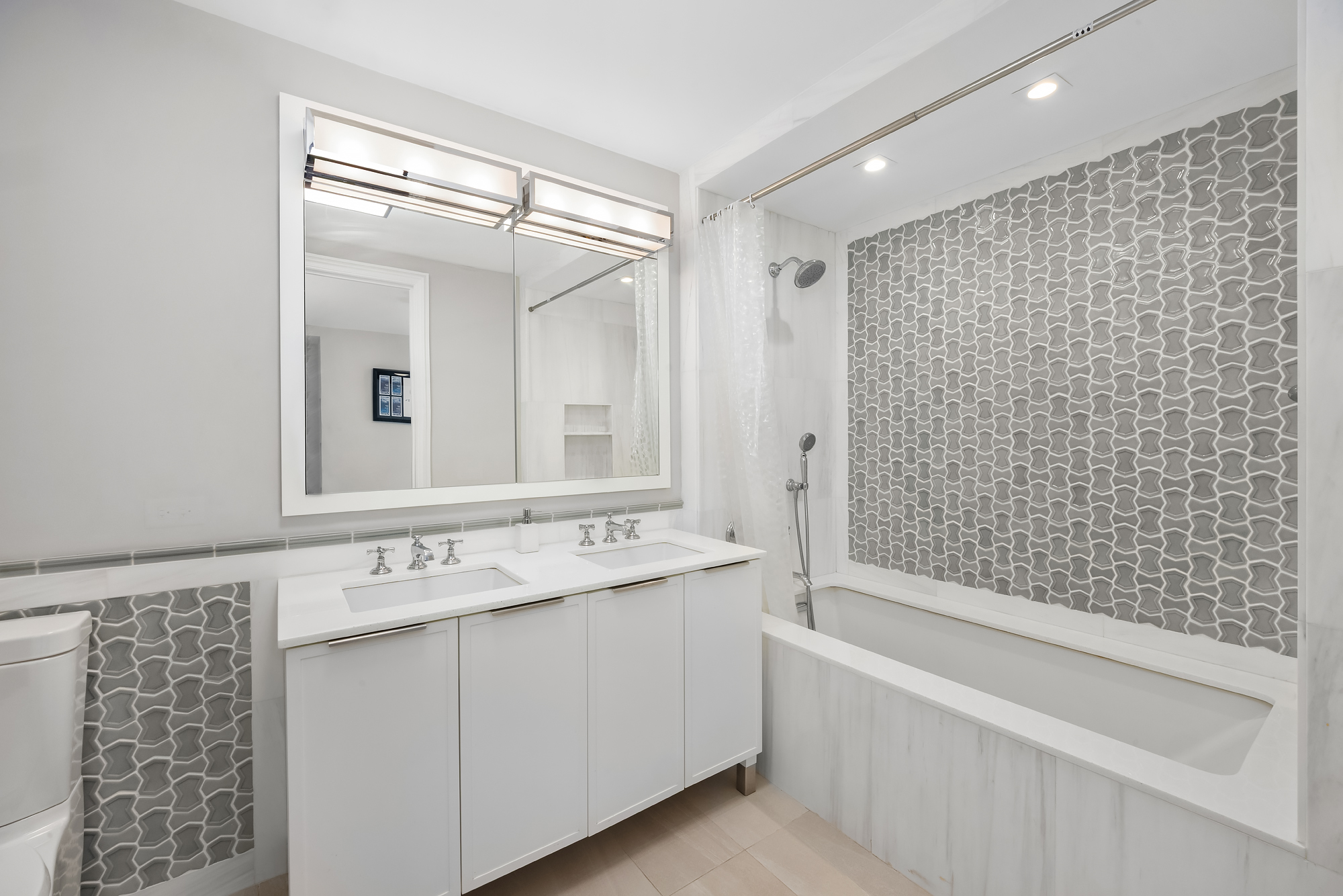 344 West 72nd Street, Unit 1007 Manhattan, NY 10023 - Photo 12 of 23 a bathroom with a bathtub and a sink