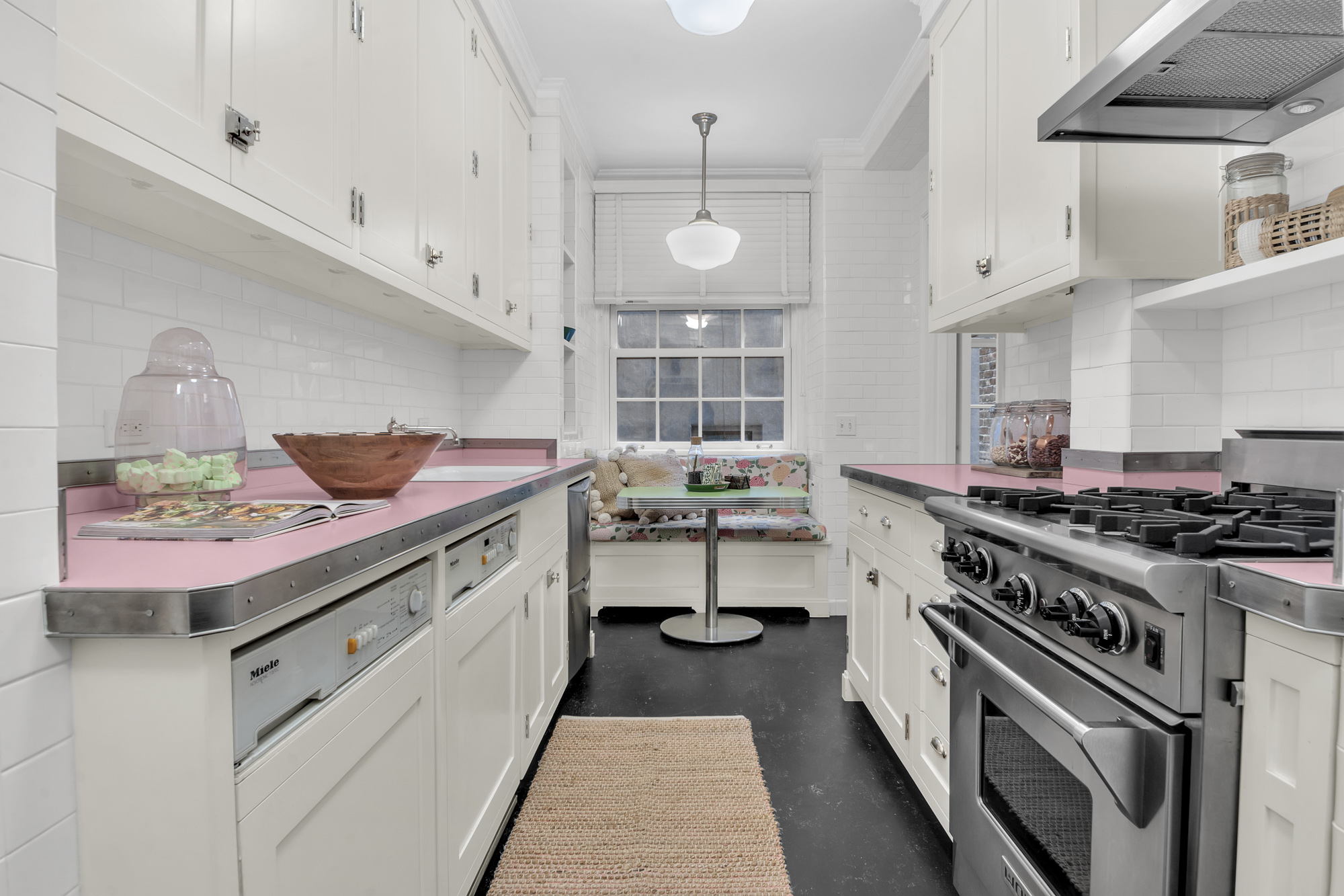 7 Gracie Square, Unit 5A Manhattan, NY 10128 - Photo 18 of 26 a kitchen with a stove and a sink