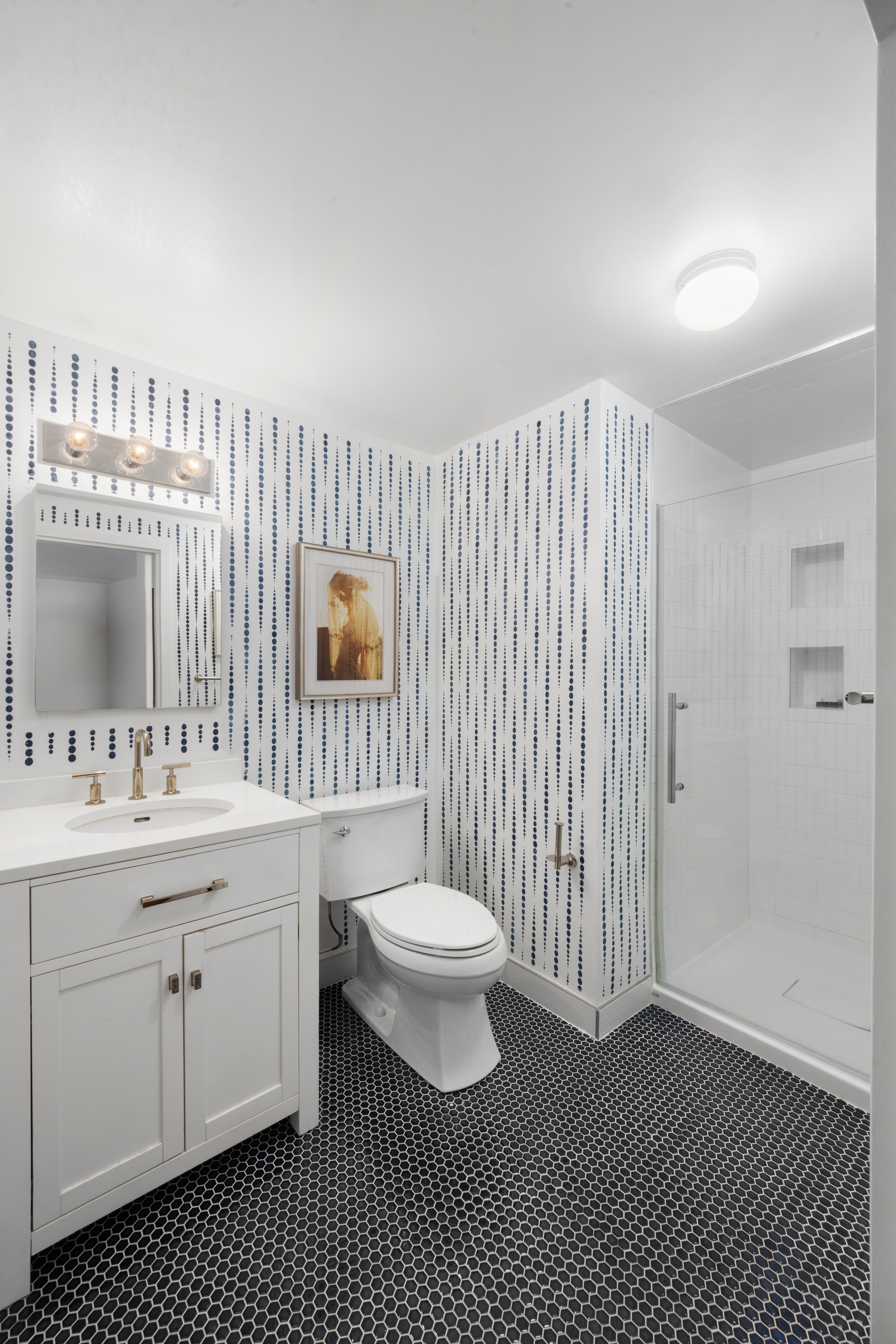 333 East 119th Street, Unit 1H Manhattan, NY 10035 - Photo 12 of 17 a bathroom with a sink a toilet and a mirror